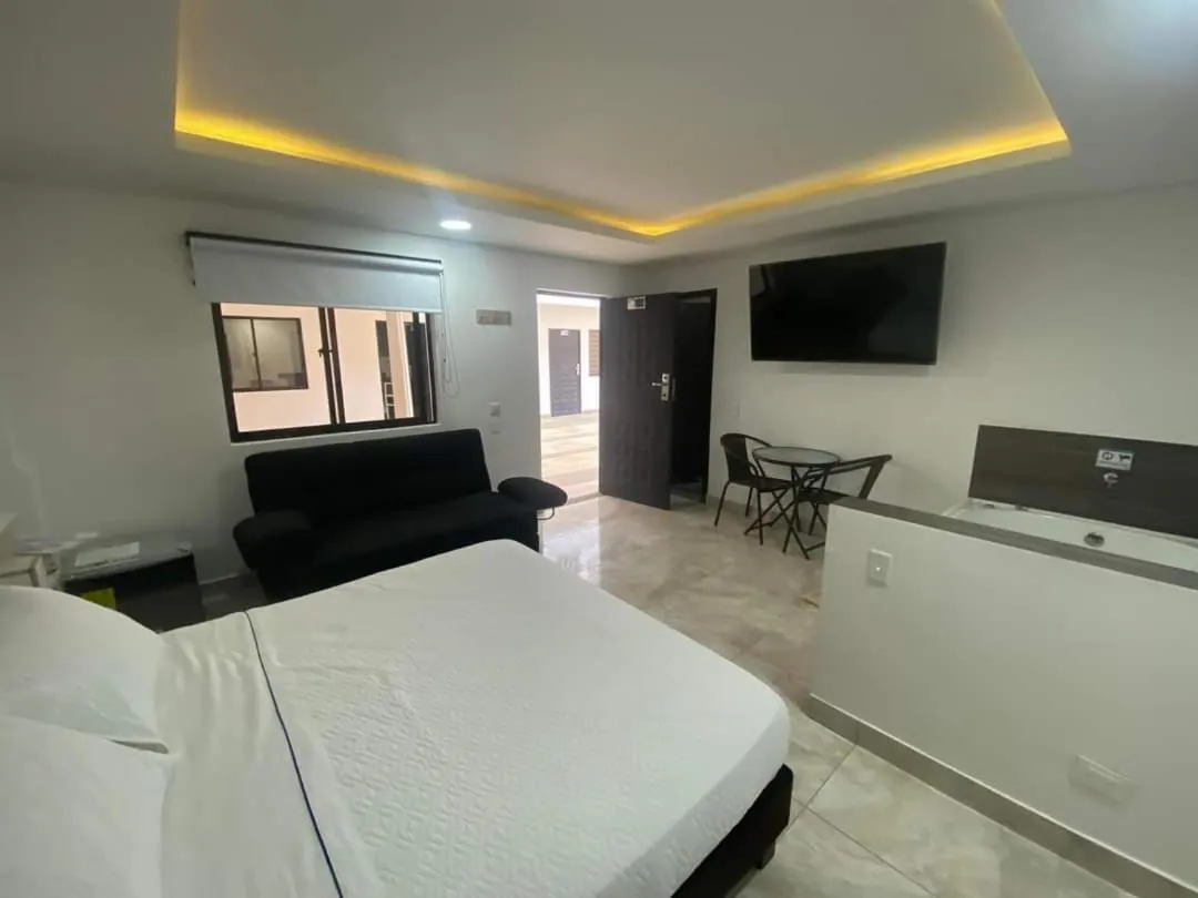 Communal lounge/ TV room, Bed in Hotel deluxe oasis de la colina boutique