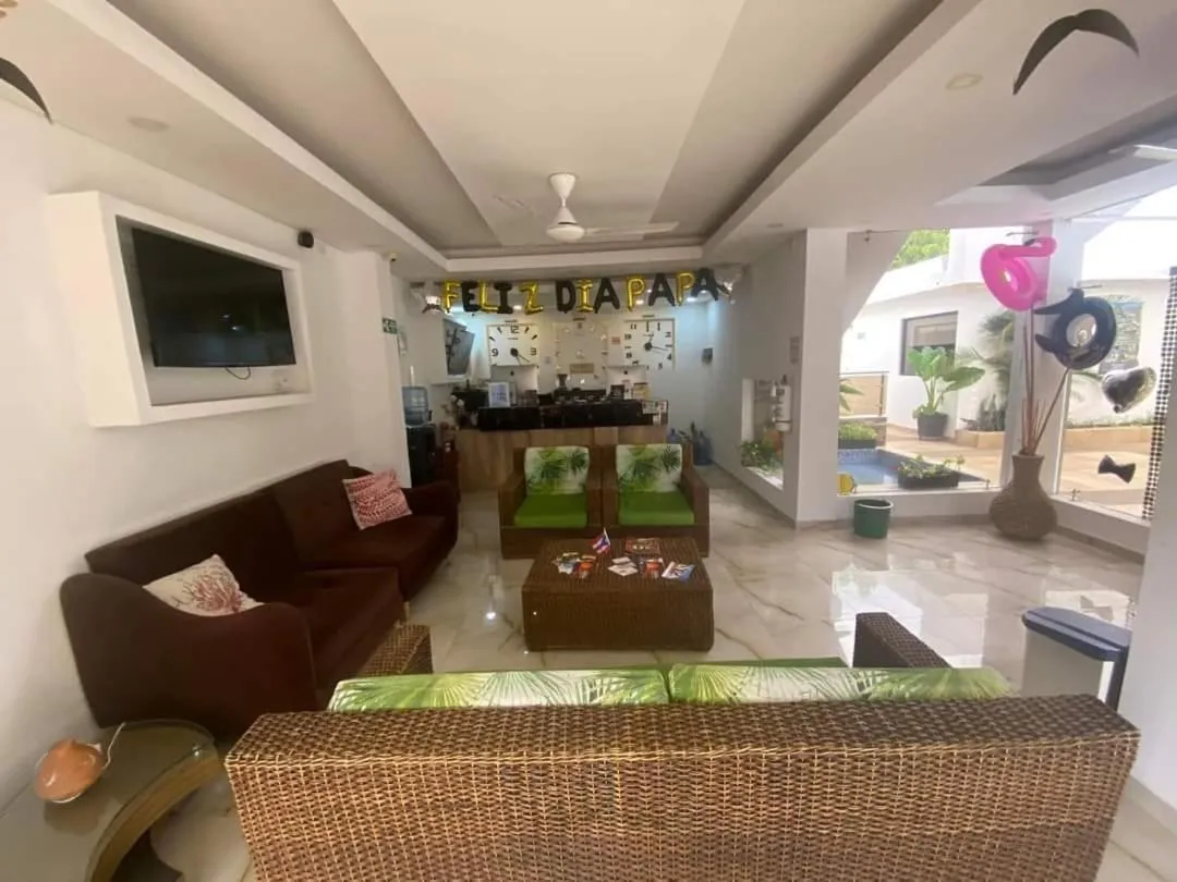 Communal lounge/ TV room in Hotel deluxe oasis de la colina boutique