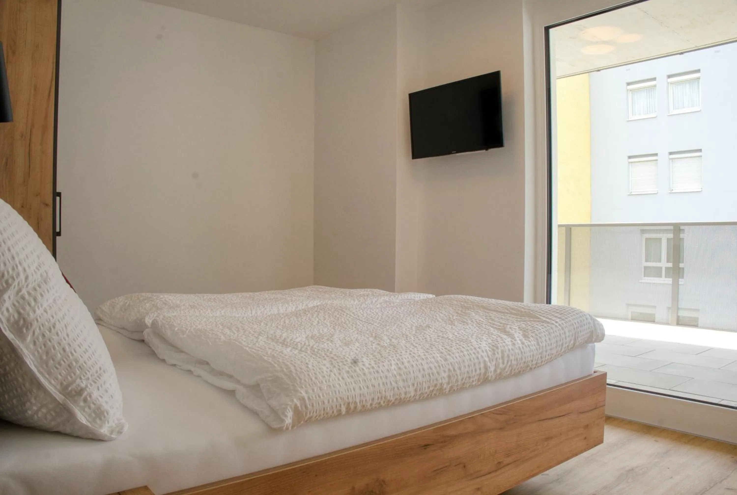 Bed in myQuartier City Chalets digital self check in