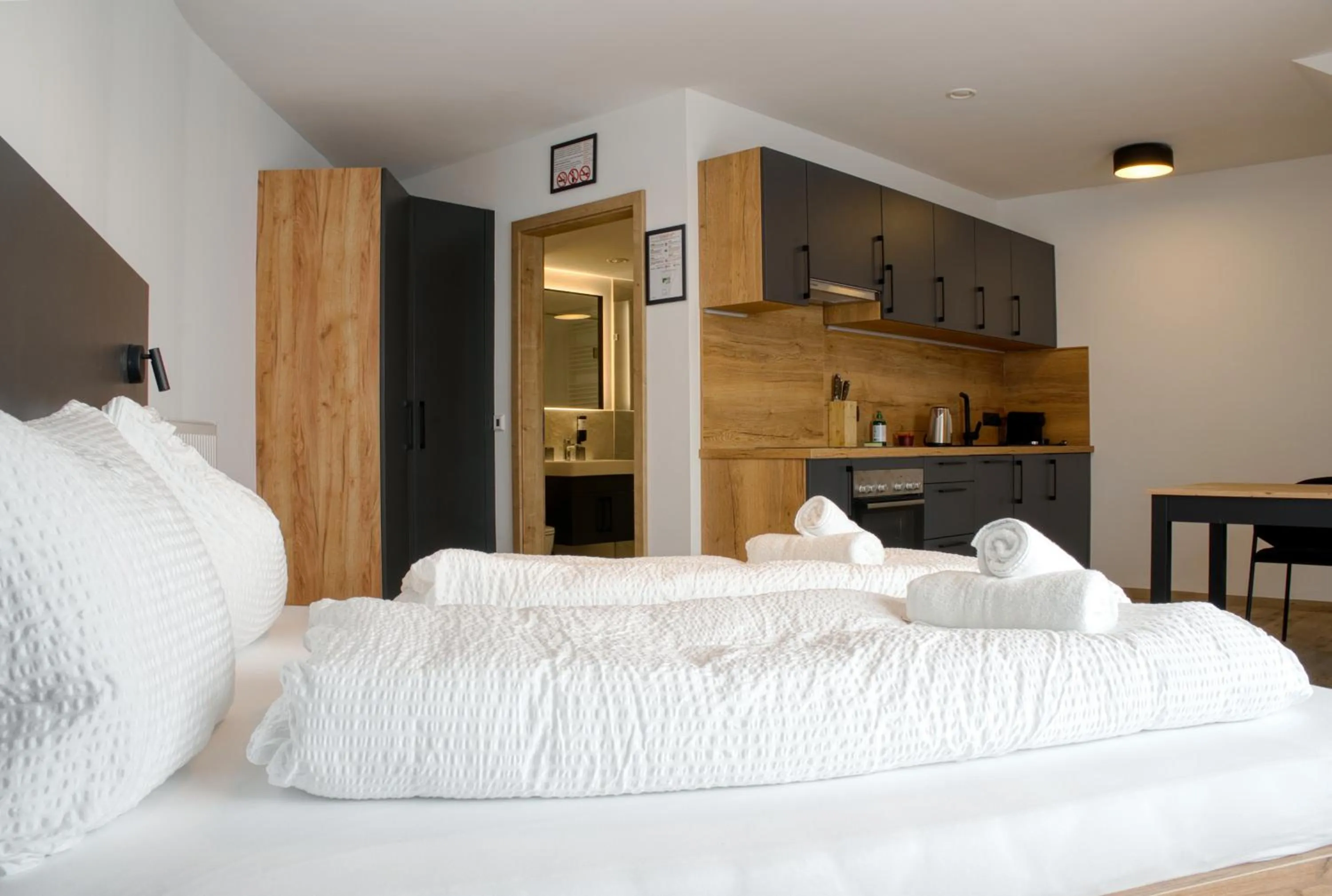 Bed in myQuartier City Chalets digital self check in