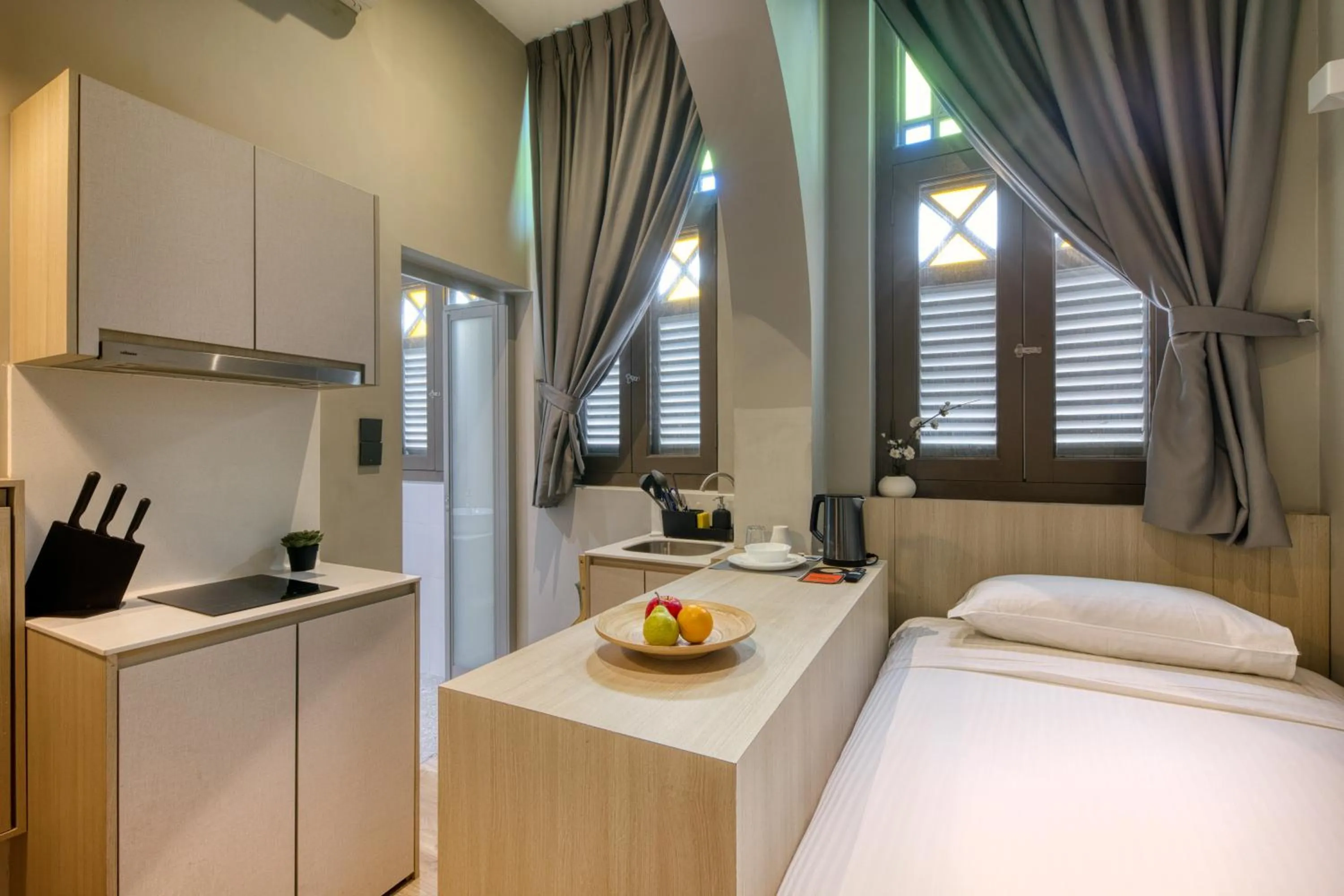 Photo of the whole room, Bed in Habyt Studios Kallang