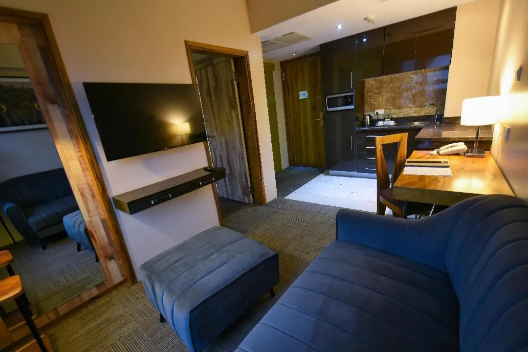 Living room, Bed in Arcadia Suites - Kampala