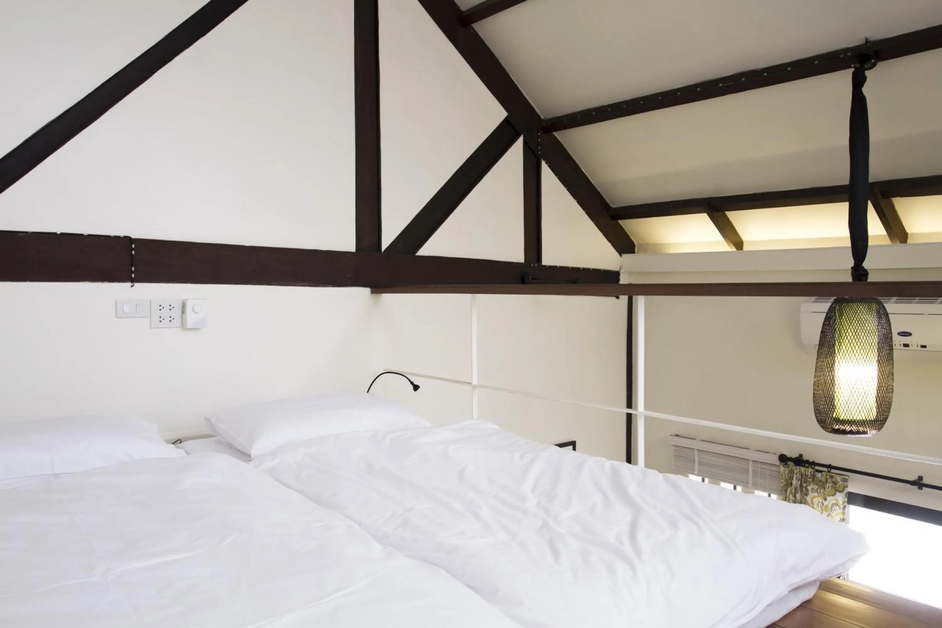 Bed in Baan Luang Rajamaitri Historic Inn