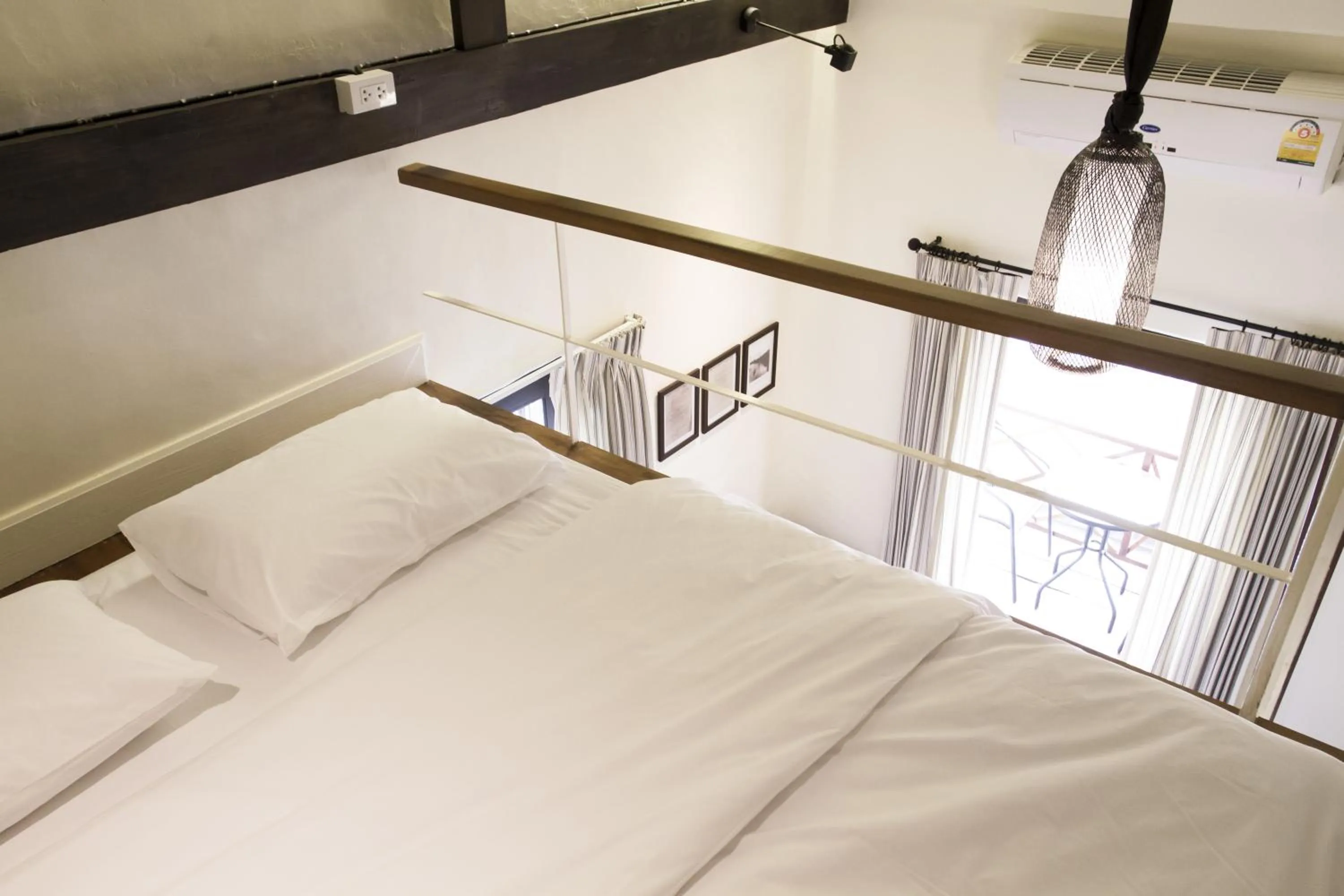 Bed in Baan Luang Rajamaitri Historic Inn