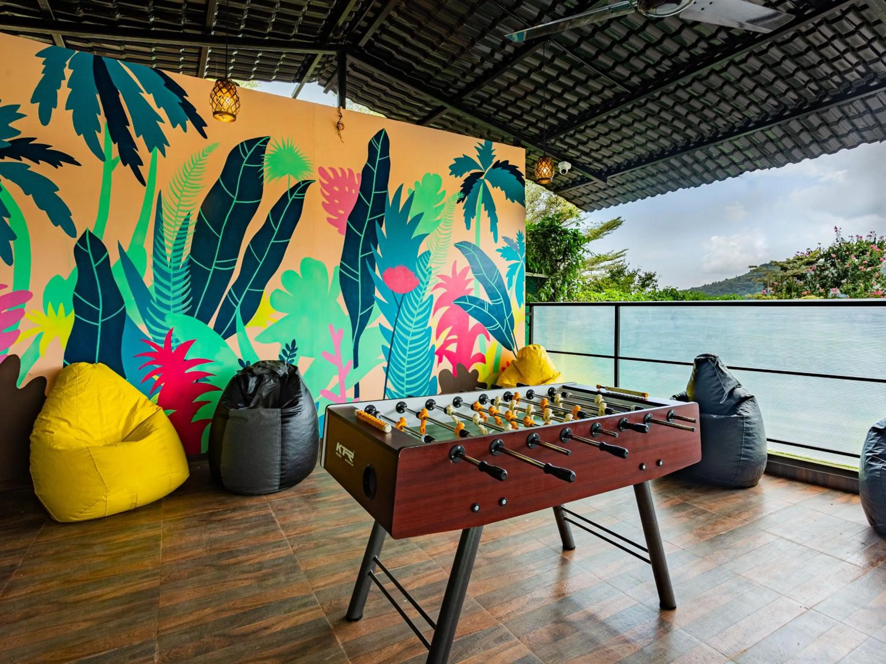 Communal lounge/ TV room in The Hosteller Panshet