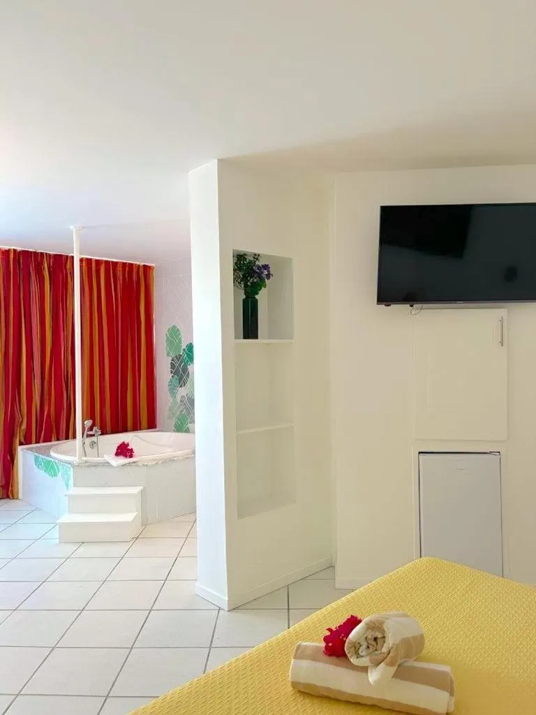 Bathroom, Bed in Le Domaine Anse Marcel Beach Resort