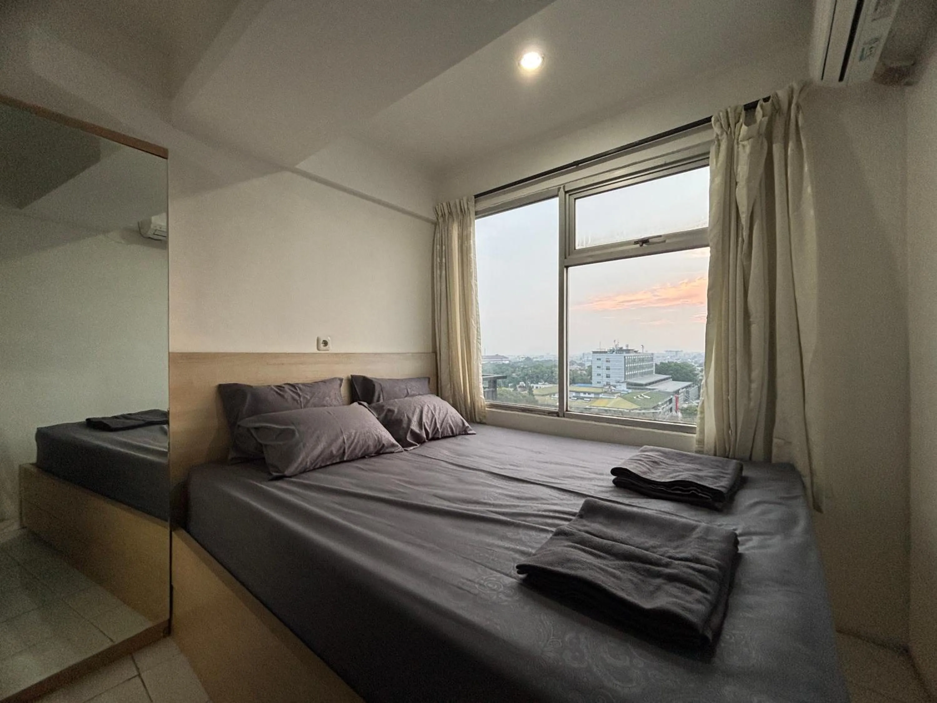 Bed in The Jarrdin Apartment Hotels by Ironman