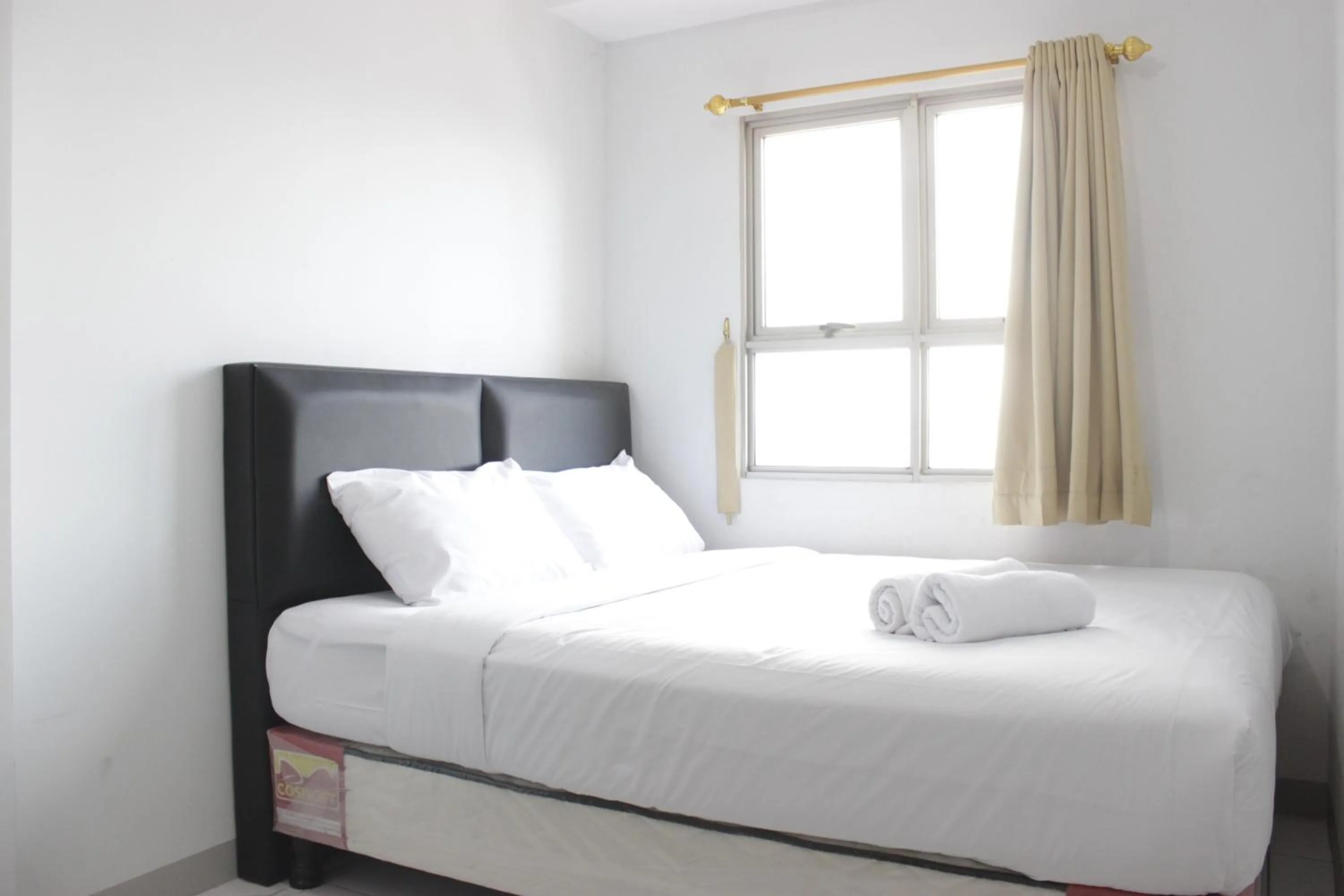 Bedroom, Bed in Comfy 2BR Apartment at Mekarwangi Square Cibaduyut By Travelio