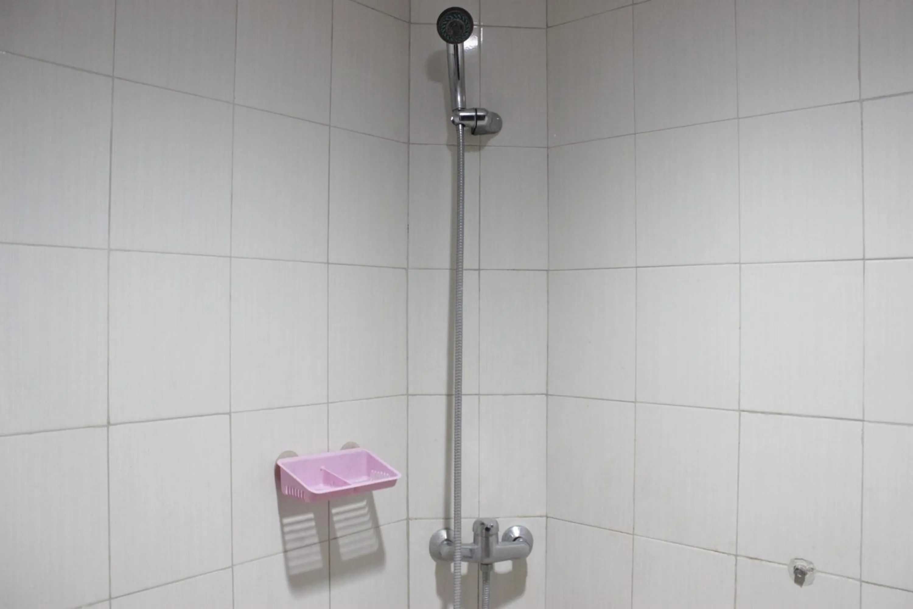 Bathroom in Comfy 2BR Apartment at Mekarwangi Square Cibaduyut By Travelio