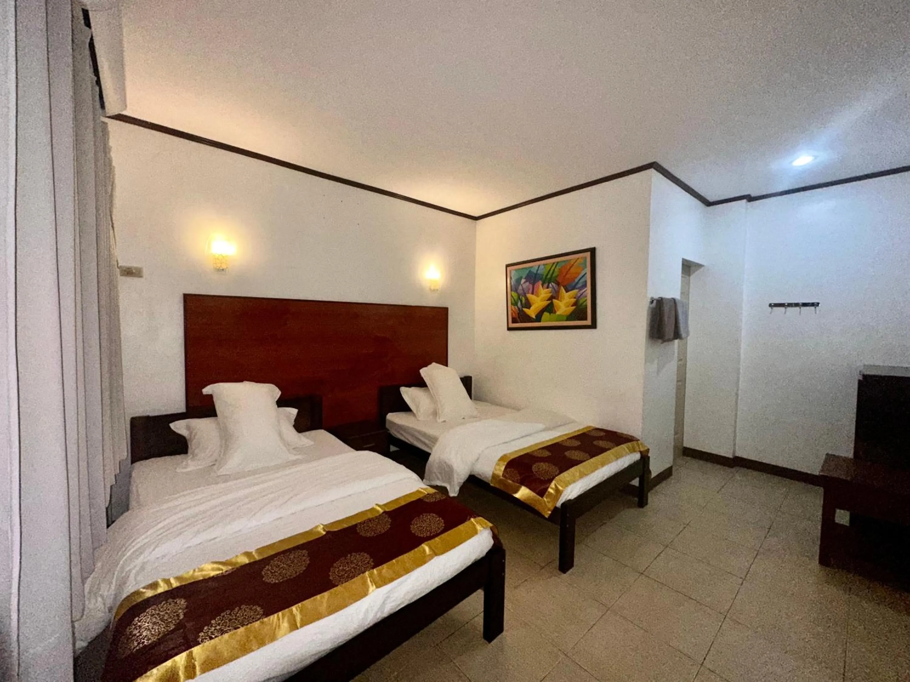 Bed in Gracey Dive Resort and Restaurant