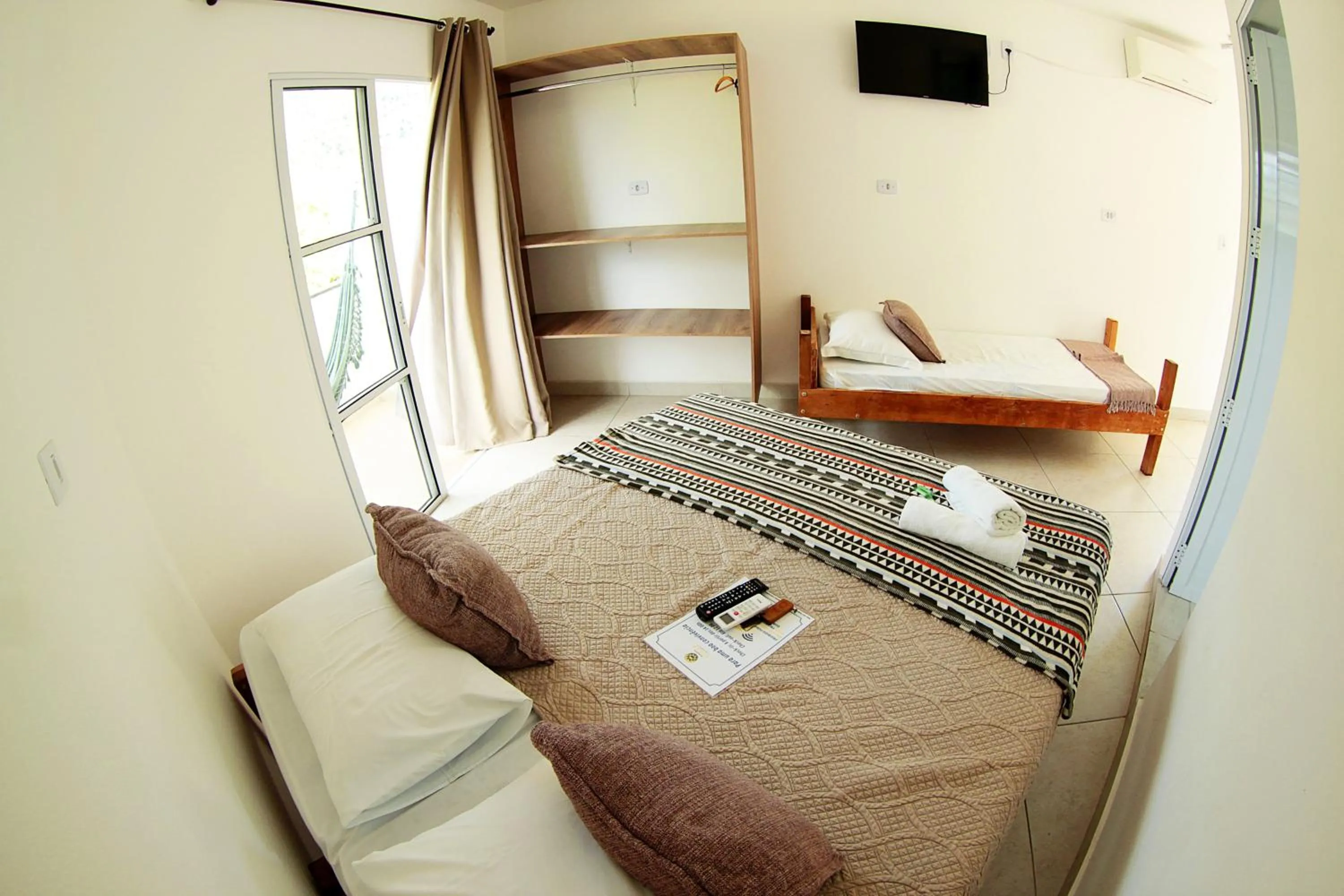 Bed in Pousada Sol e Mar