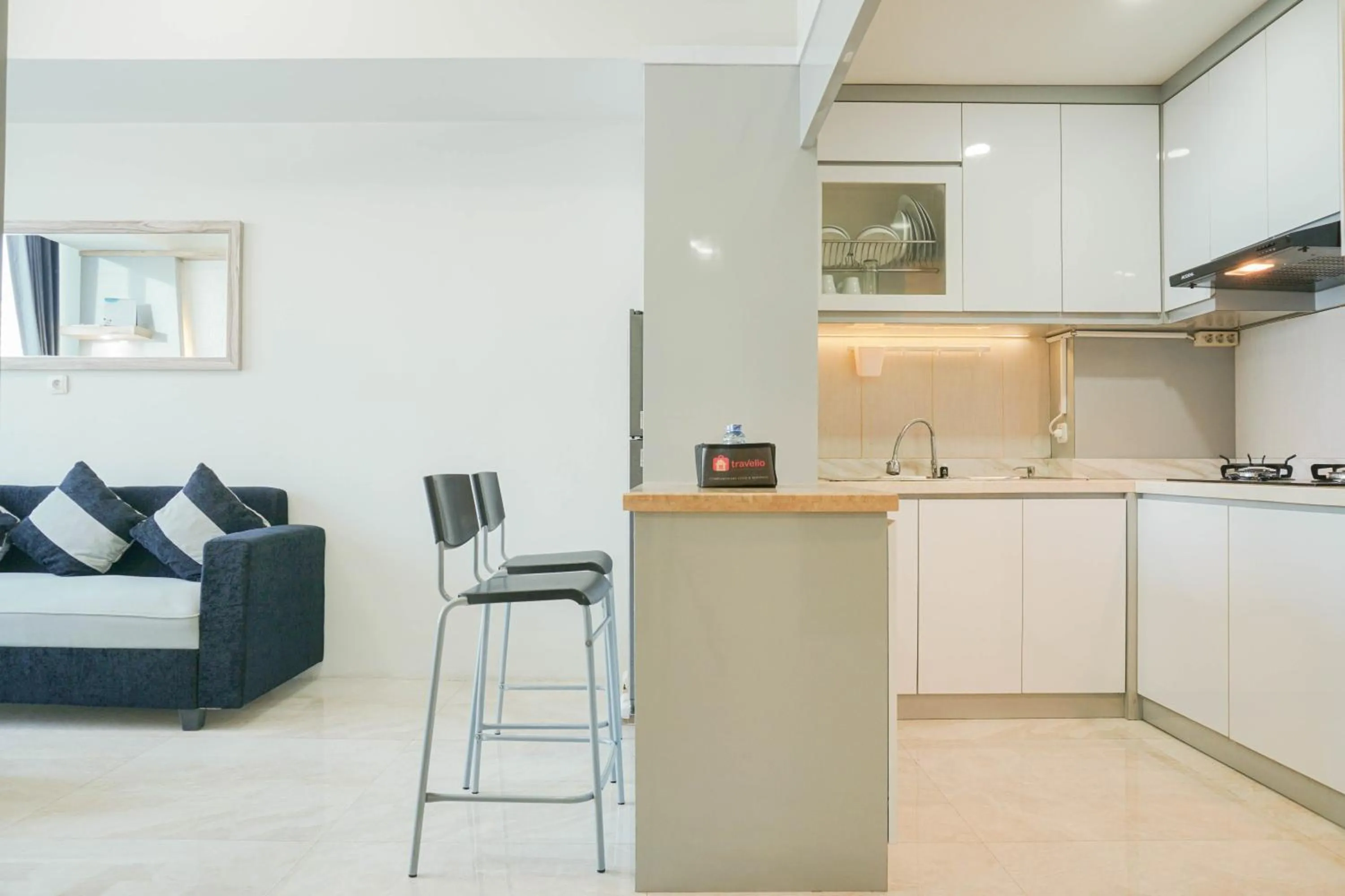 Dining area in Fully Furnished with Comfortable Design 2BR Harco Mangga Besar Apartment By Travelio