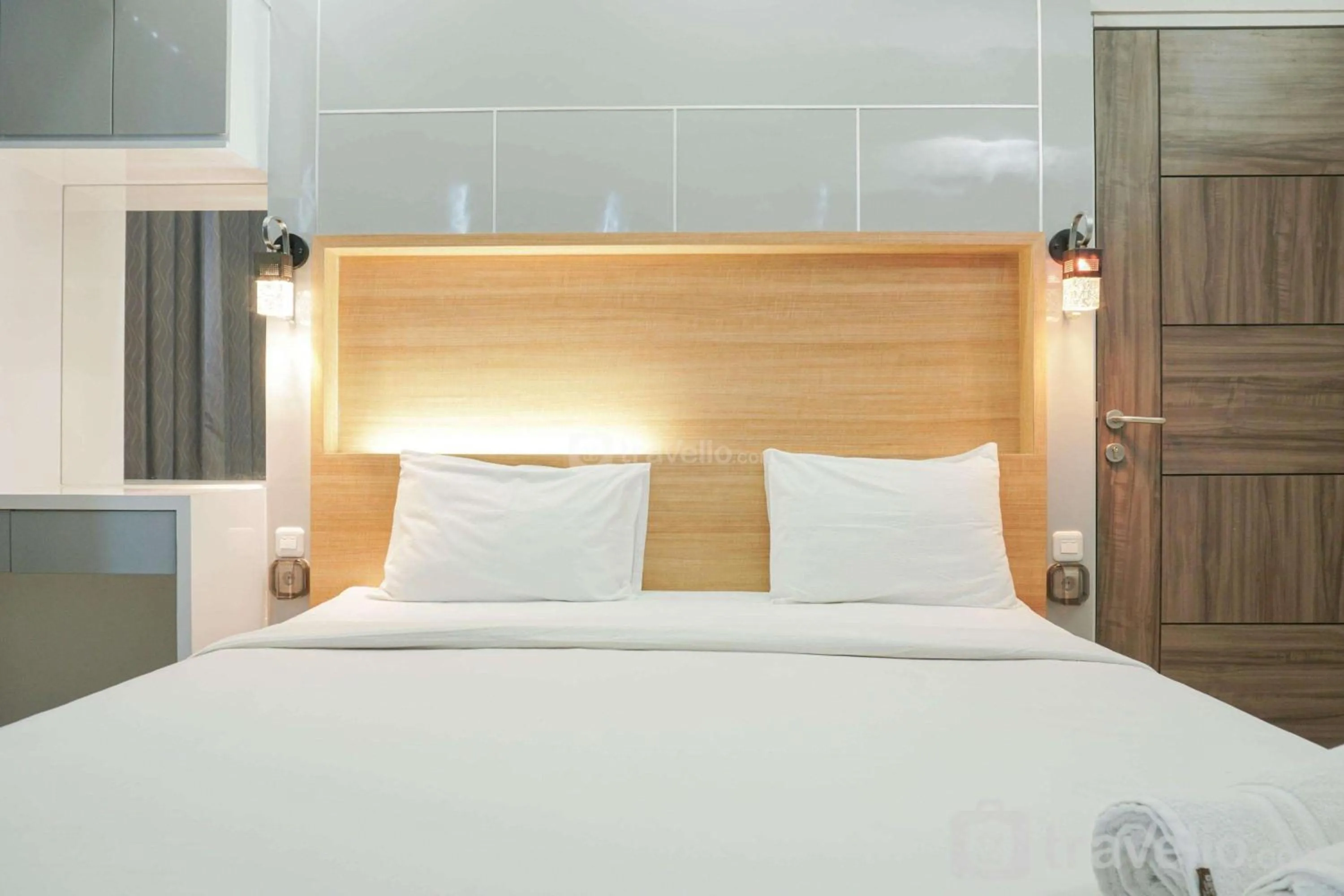 Bed in Fully Furnished with Comfortable Design 2BR Harco Mangga Besar Apartment By Travelio