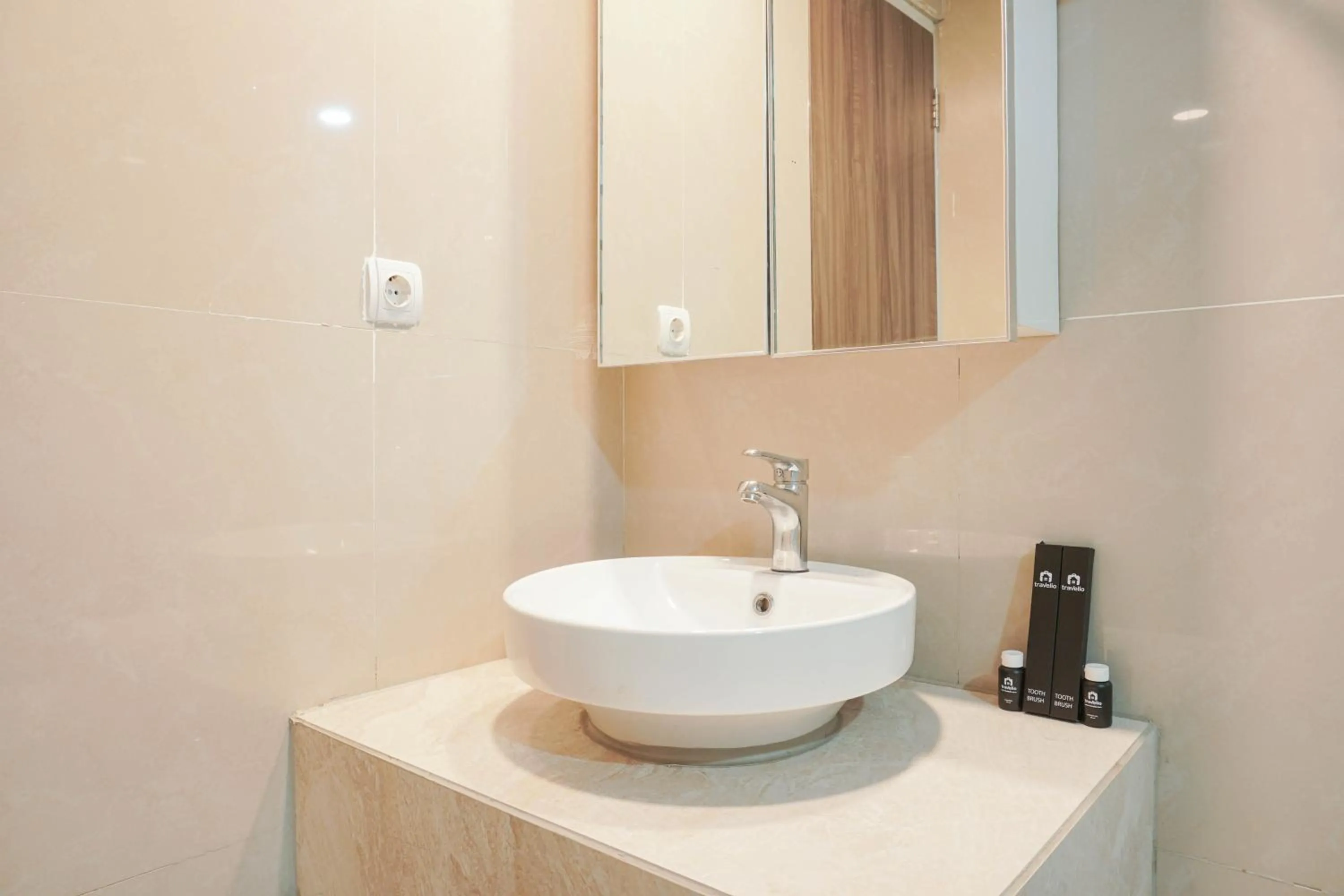 Bathroom in Fully Furnished with Comfortable Design 2BR Harco Mangga Besar Apartment By Travelio