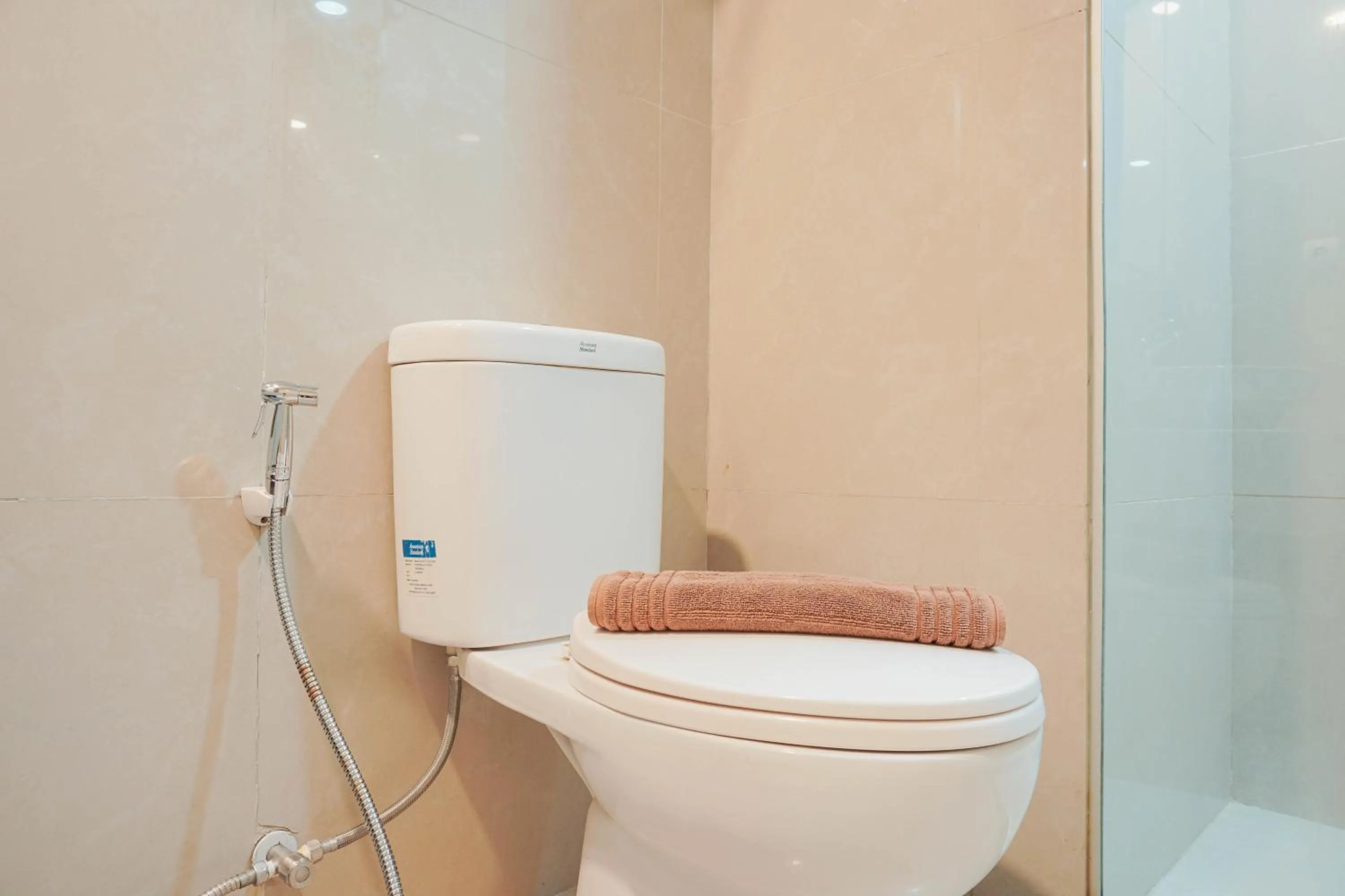 Bathroom in Fully Furnished with Comfortable Design 2BR Harco Mangga Besar Apartment By Travelio