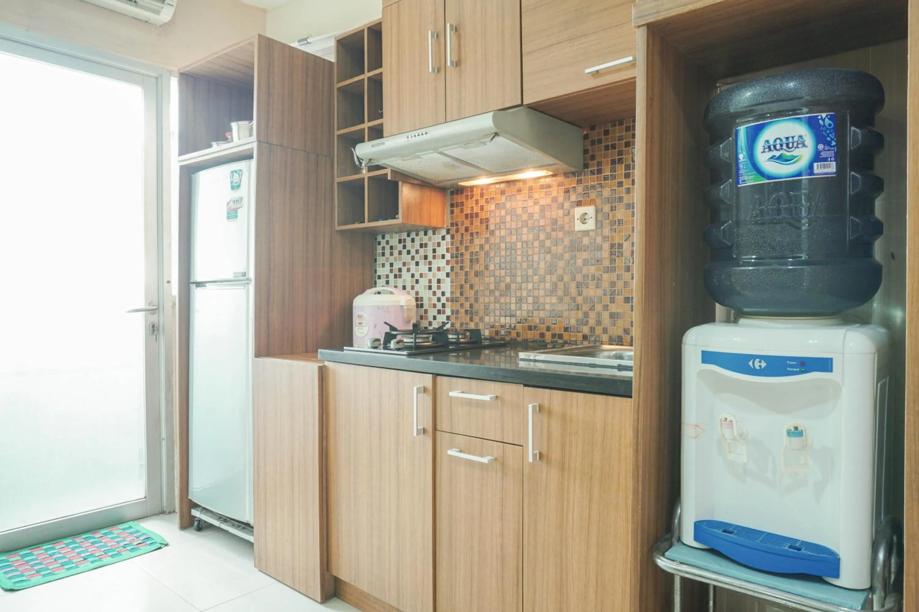 Kitchen or kitchenette in Comfy and Strategic 2BR at Menteng Square Apartment By Travelio