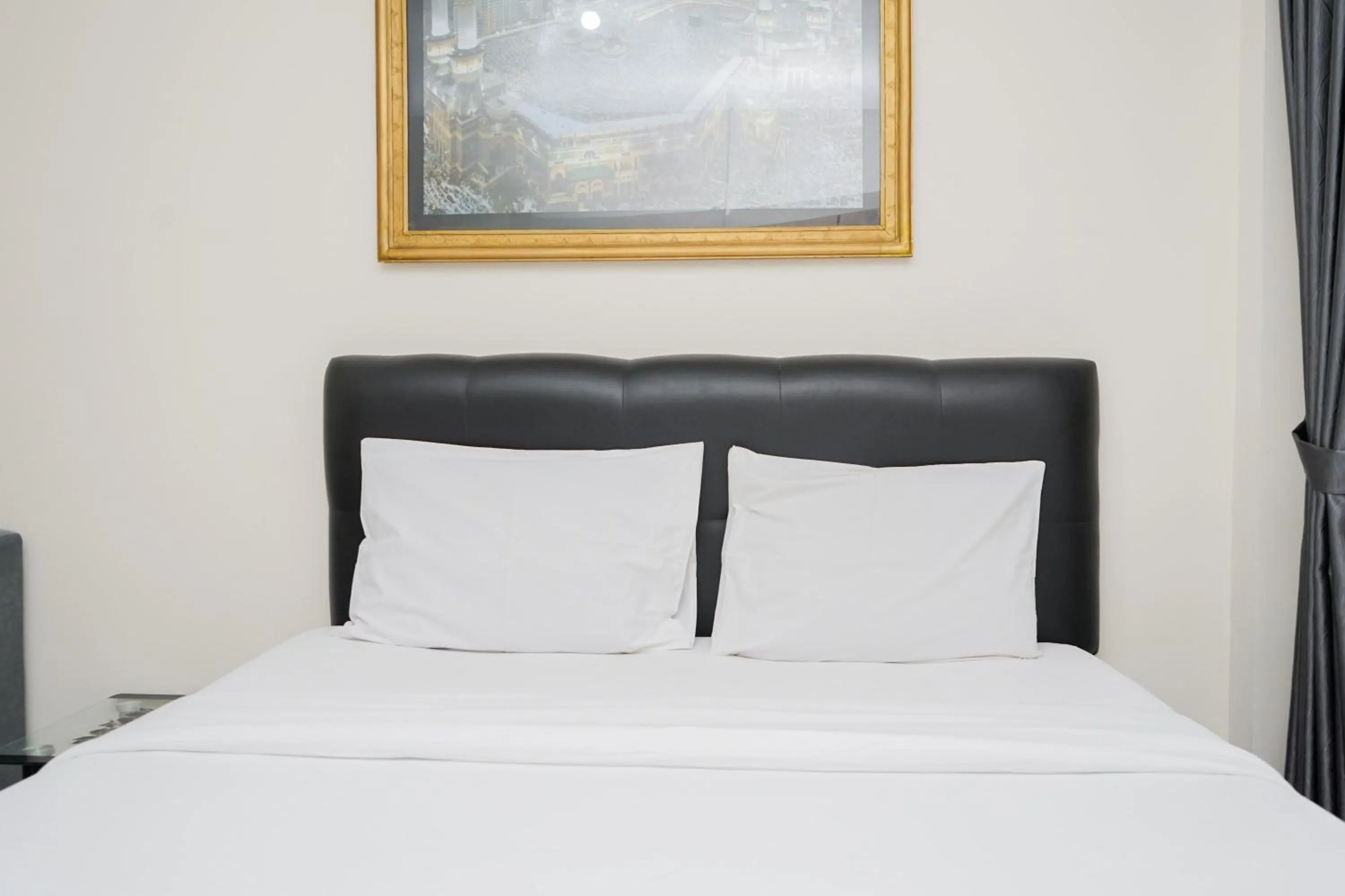 Bed in Homey and Comfact Studio at Medina Apartment By Travelio