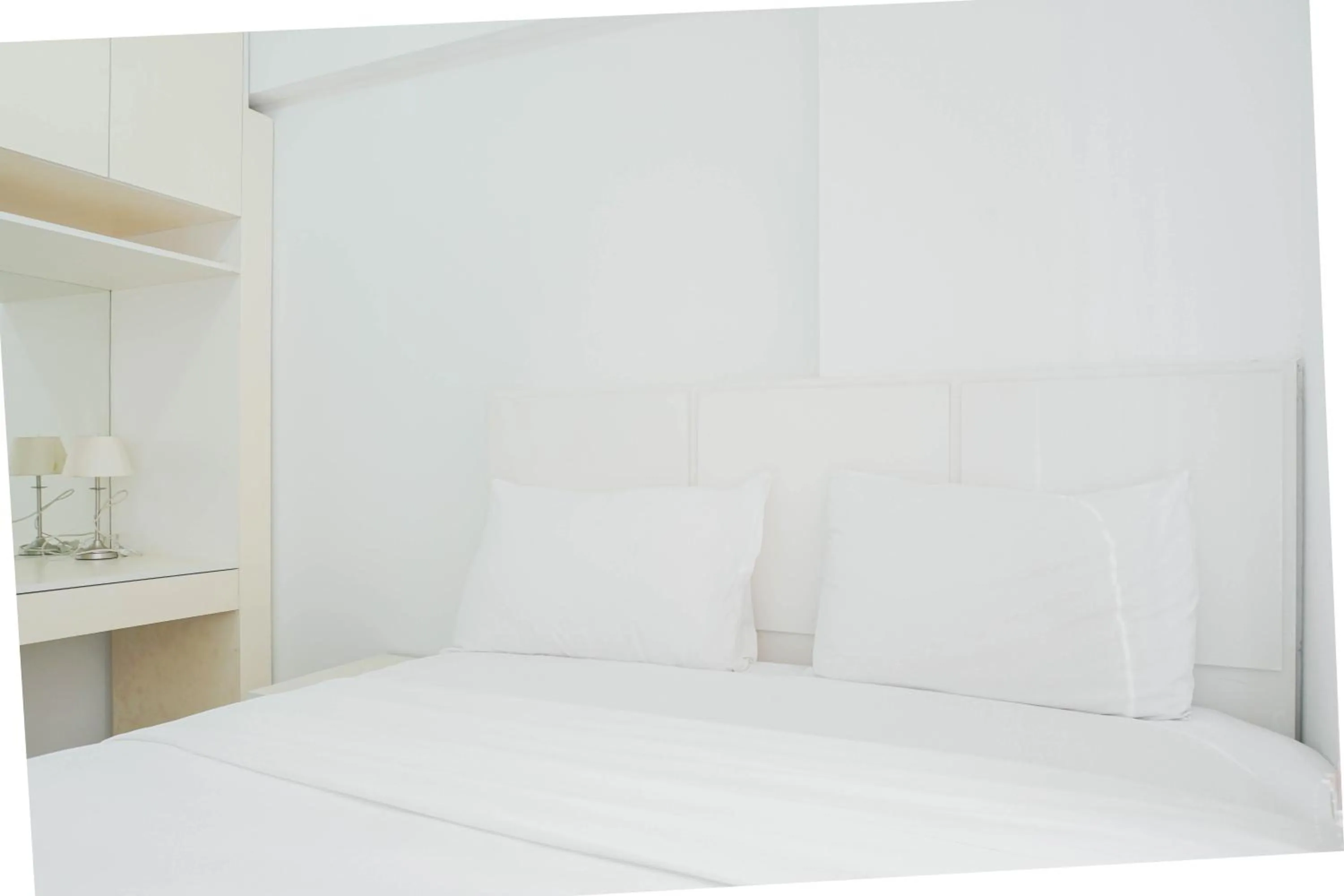 Bed in Elegant 2BR at Bassura City Apartment By Travelio