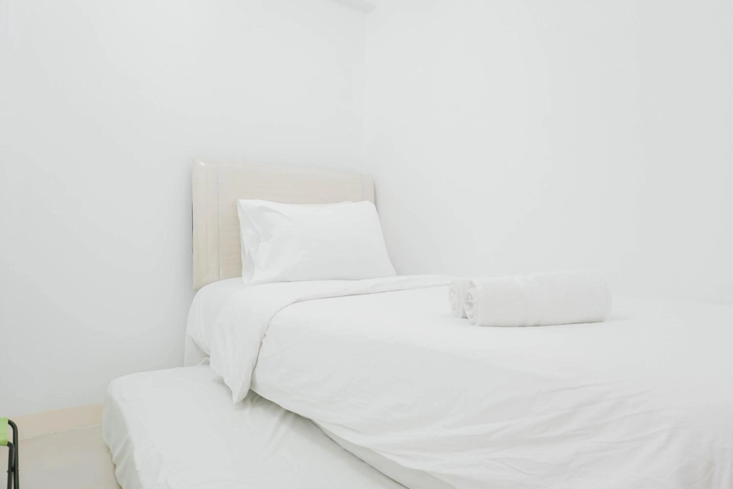 Bed in Elegant 2BR at Bassura City Apartment By Travelio