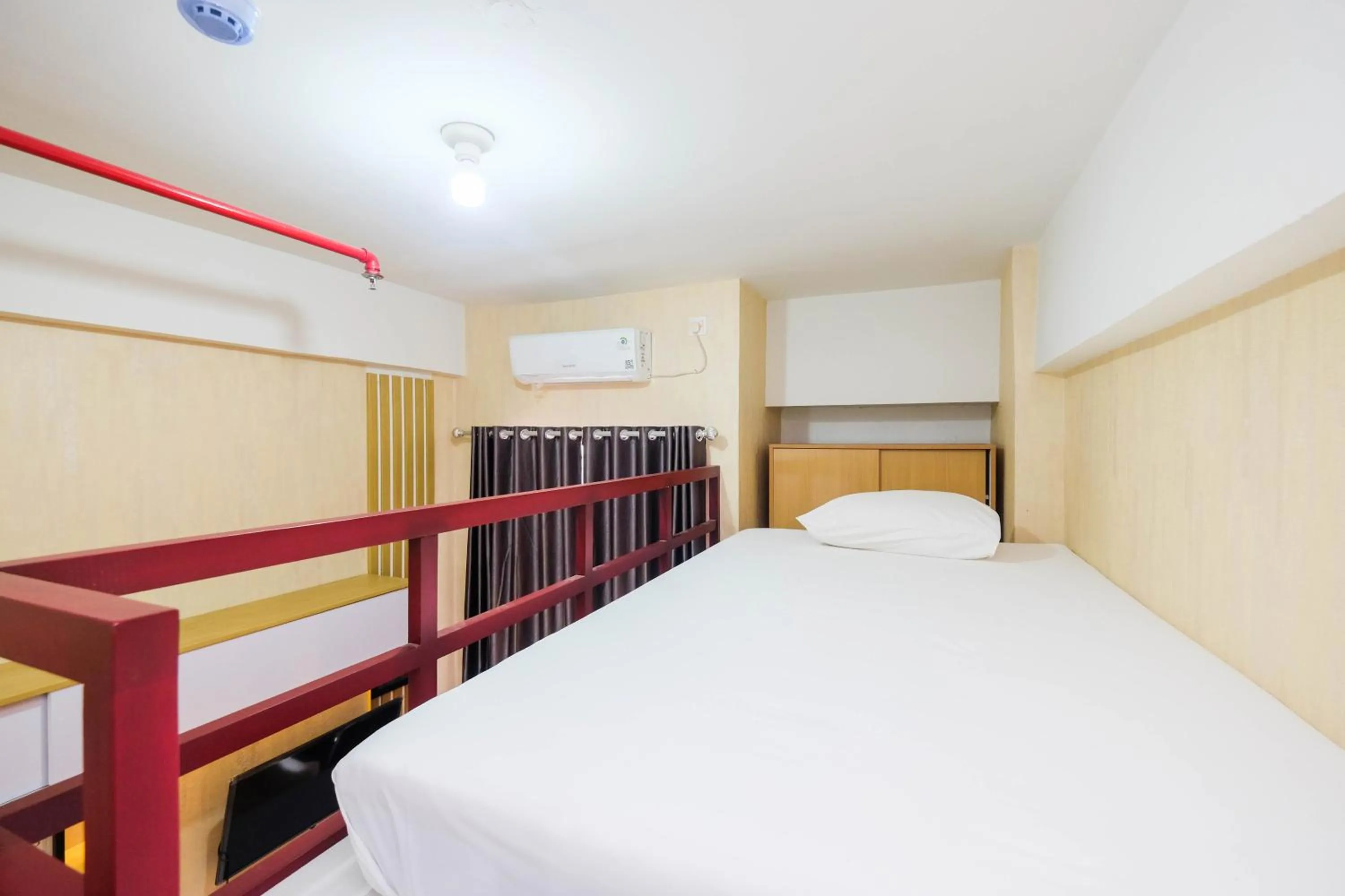 Bed in Fully Furnished Studio with Comfortable Design Dave Apartment By Travelio