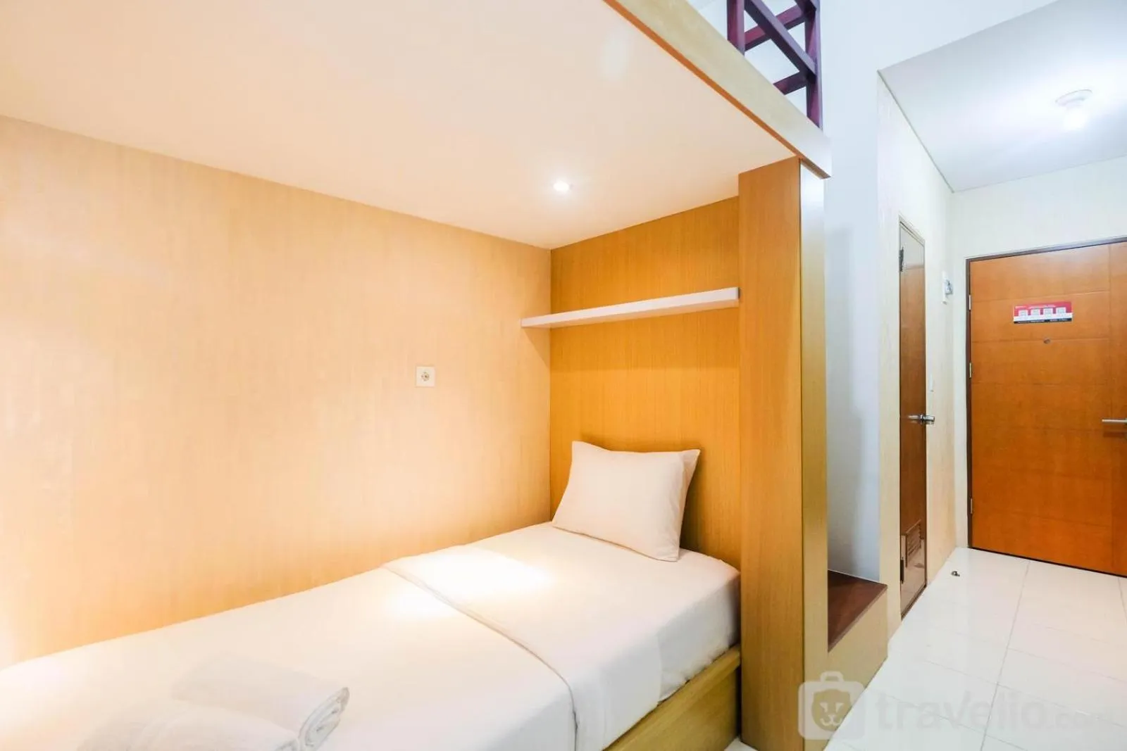 Bed in Fully Furnished Studio with Comfortable Design Dave Apartment By Travelio