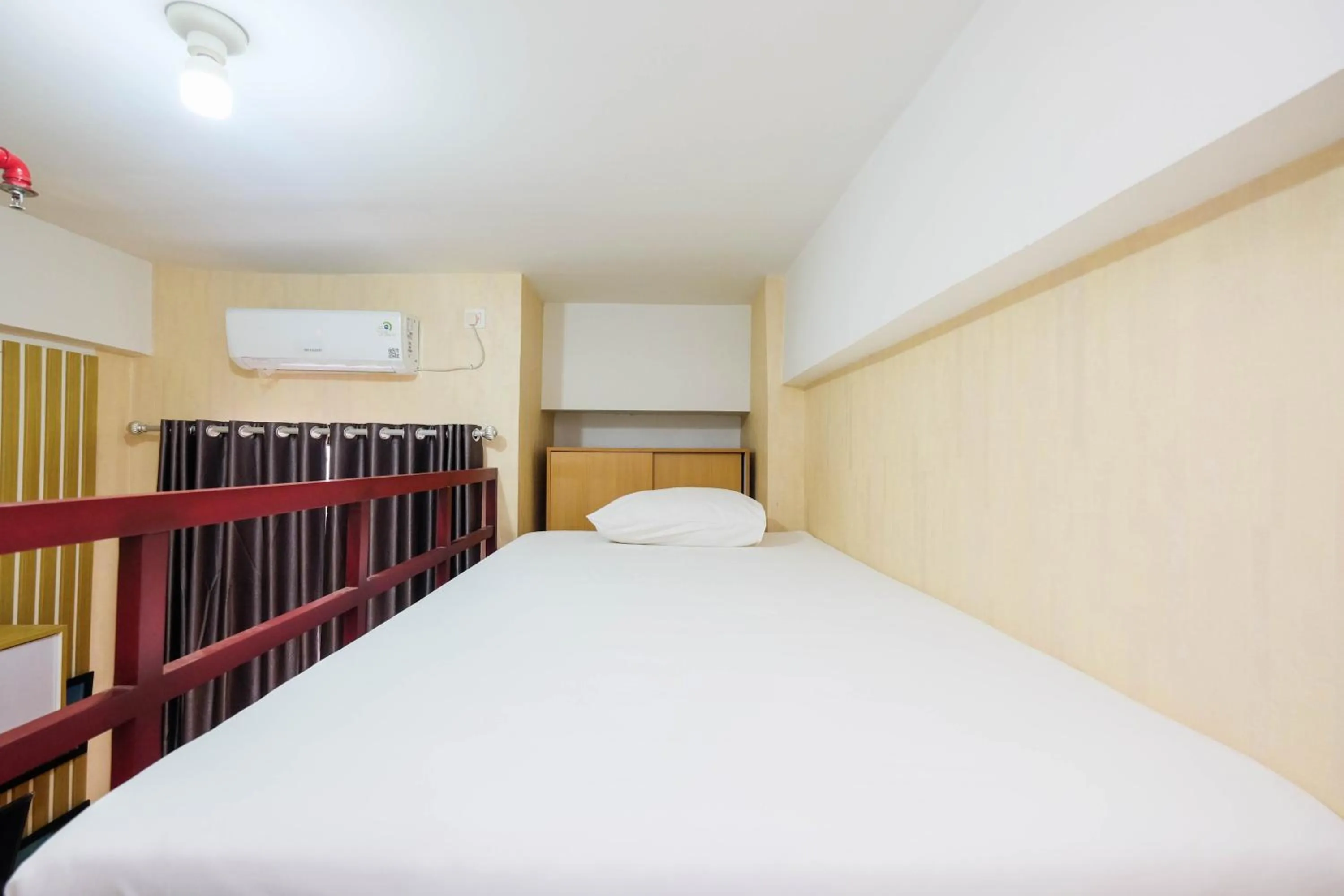 Bed in Fully Furnished Studio with Comfortable Design Dave Apartment By Travelio
