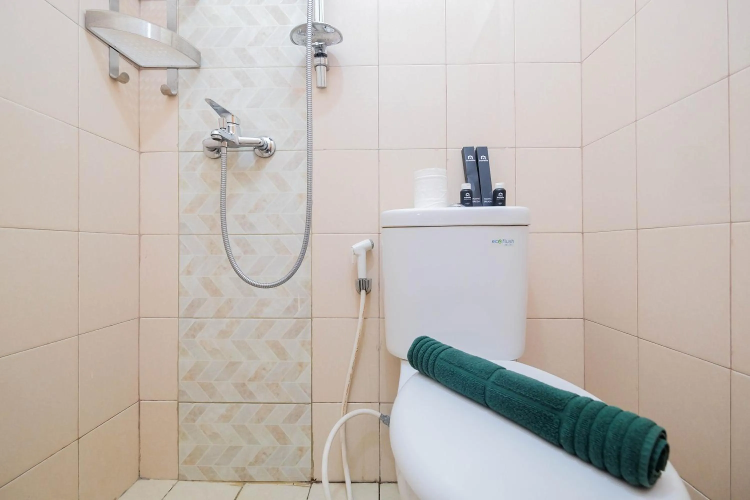 Bathroom in Cozy and Simply Studio Tifolia Apartment near Kelapa Gading By Travelio