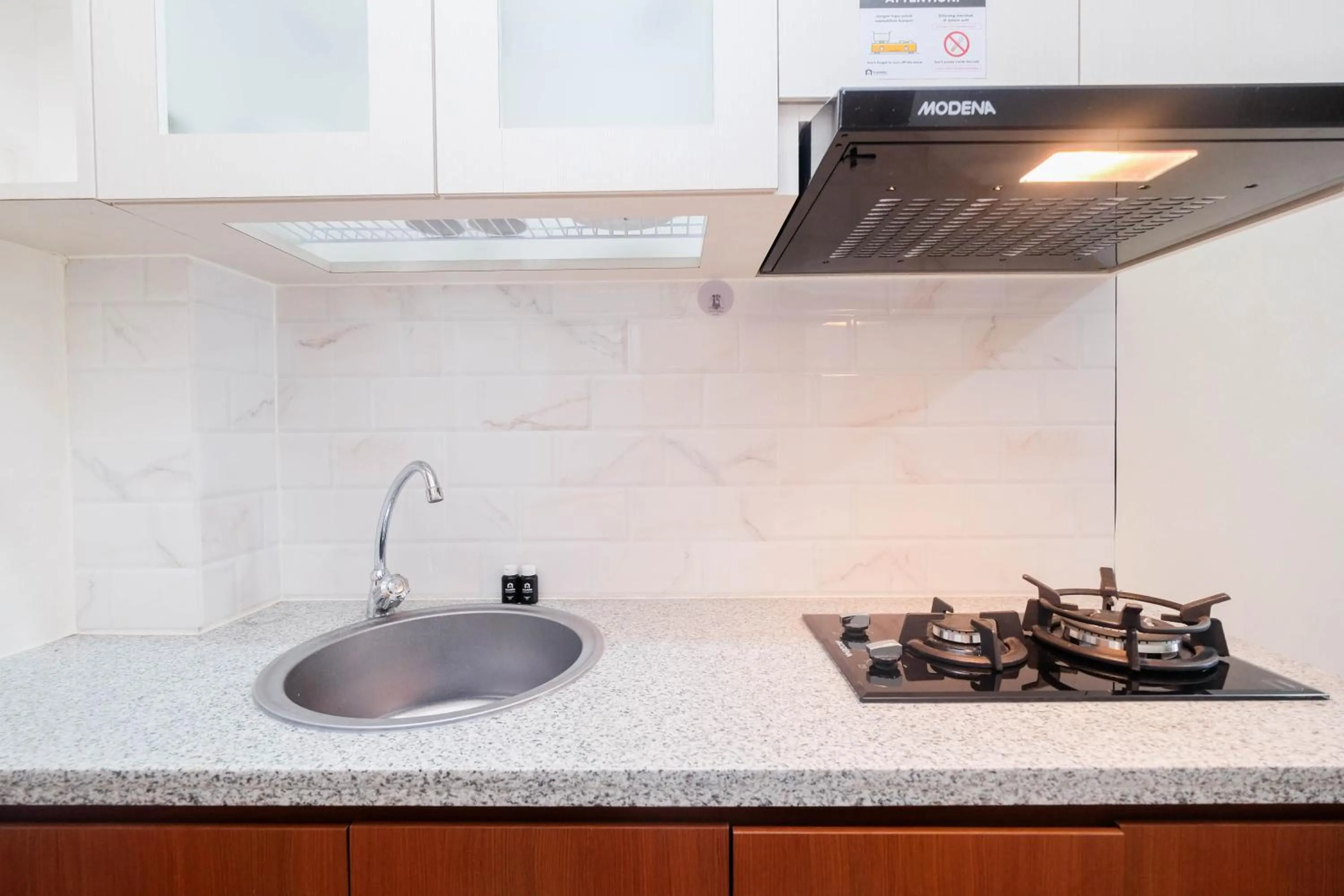 Kitchen or kitchenette in Cozy and Simply Studio Tifolia Apartment near Kelapa Gading By Travelio