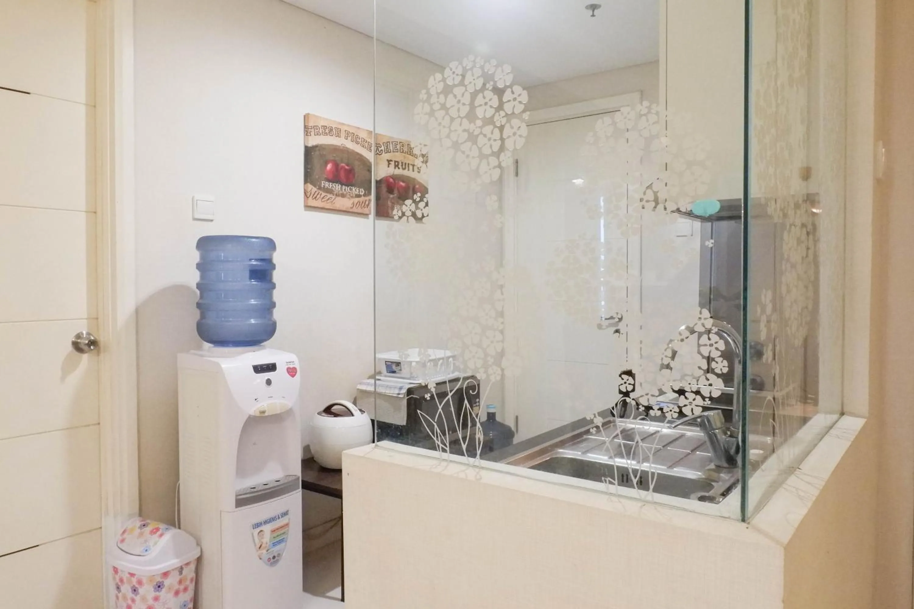 kitchen in Scenic Modern 2BR Apartment at Trillium Residence By Travelio