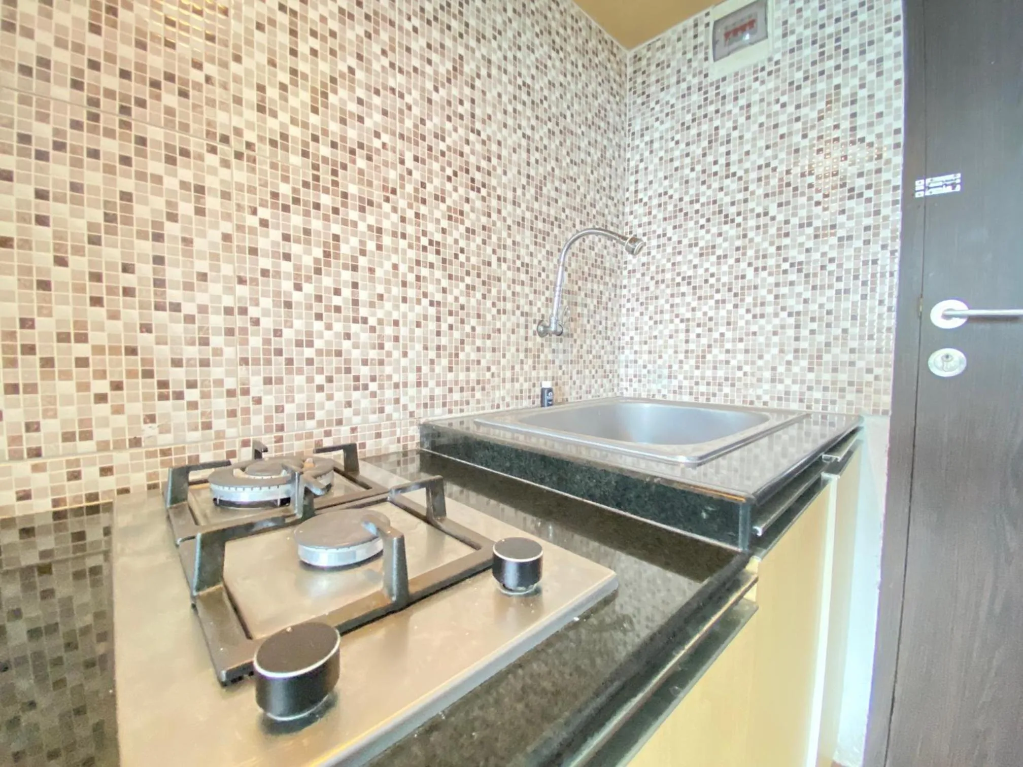 Kitchen or kitchenette in Quite 2BR Apartment AC in Living Room at The Jarrdin Cihampelas By Travelio