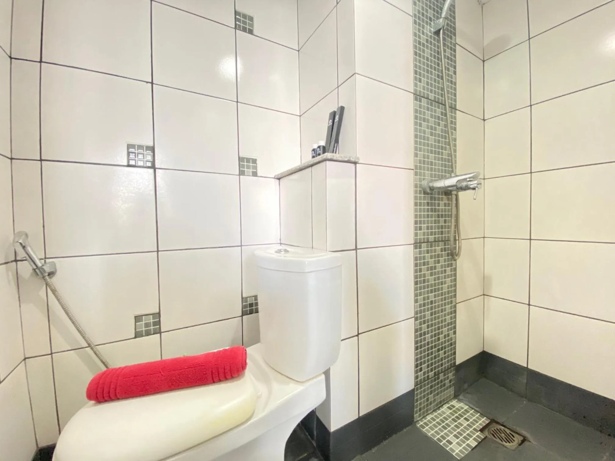 Bathroom in Quite 2BR Apartment AC in Living Room at The Jarrdin Cihampelas By Travelio