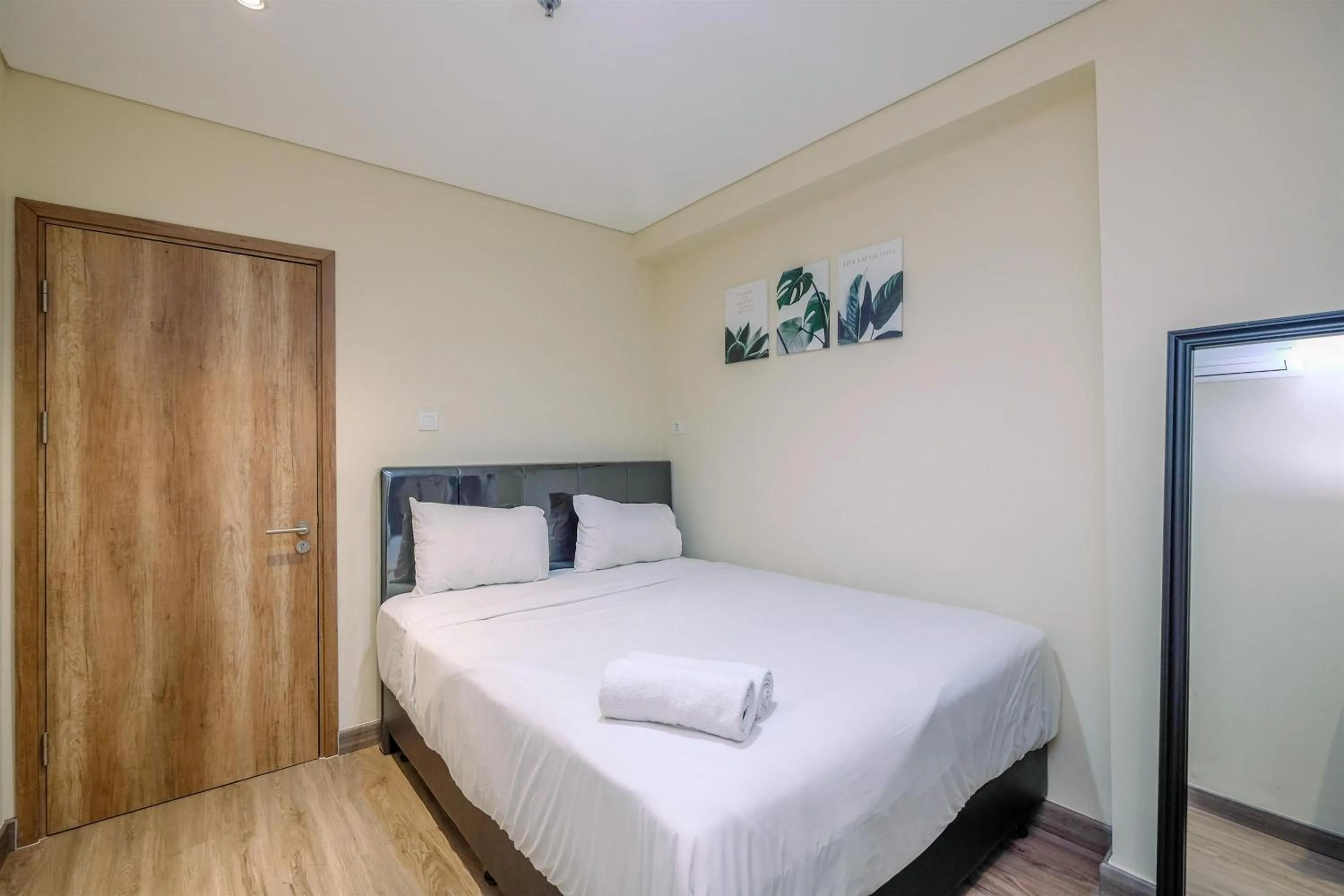 Bed in Simply 1BR Apartment at Pejaten Park Residence By Travelio