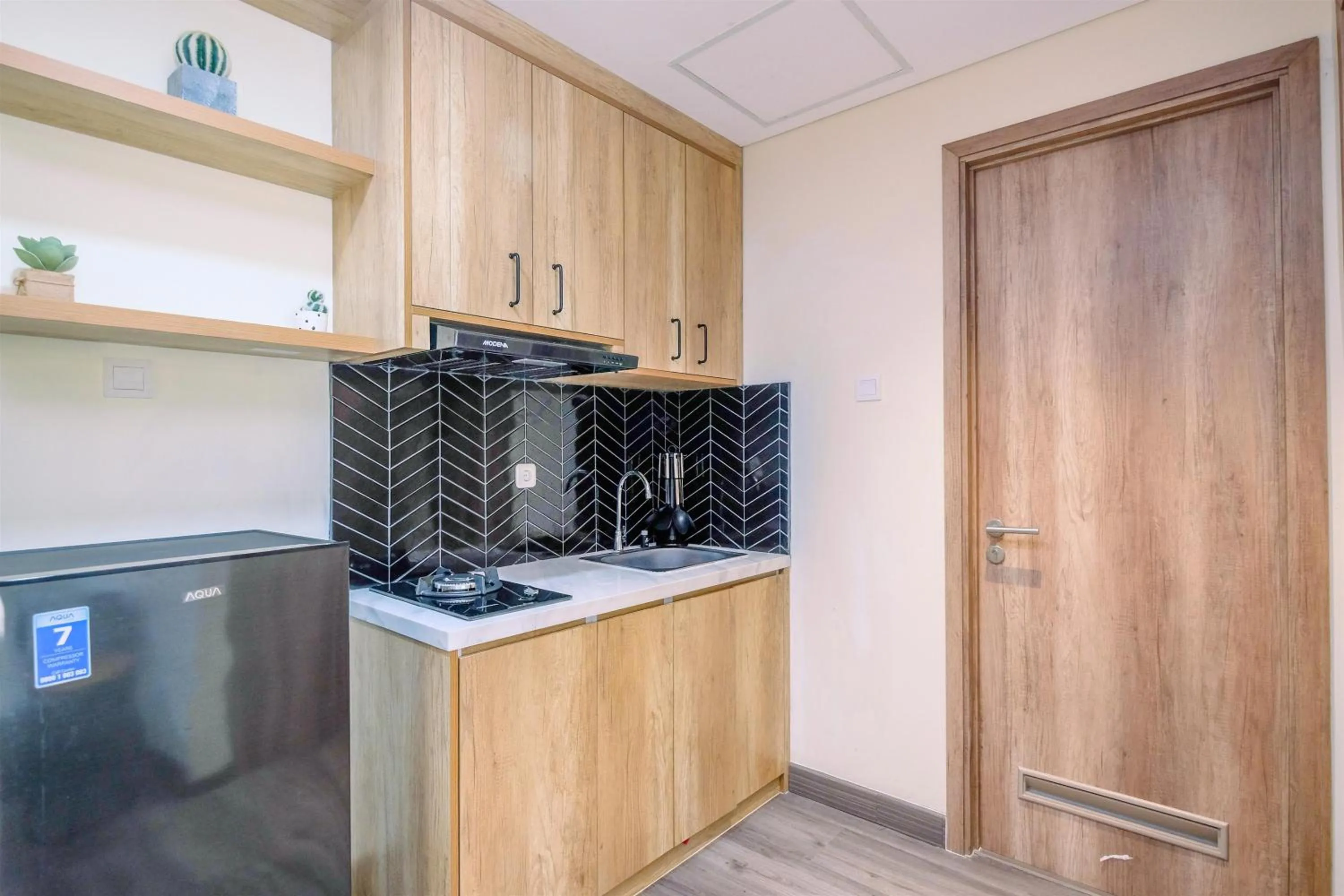 Kitchen or kitchenette in Simply 1BR Apartment at Pejaten Park Residence By Travelio