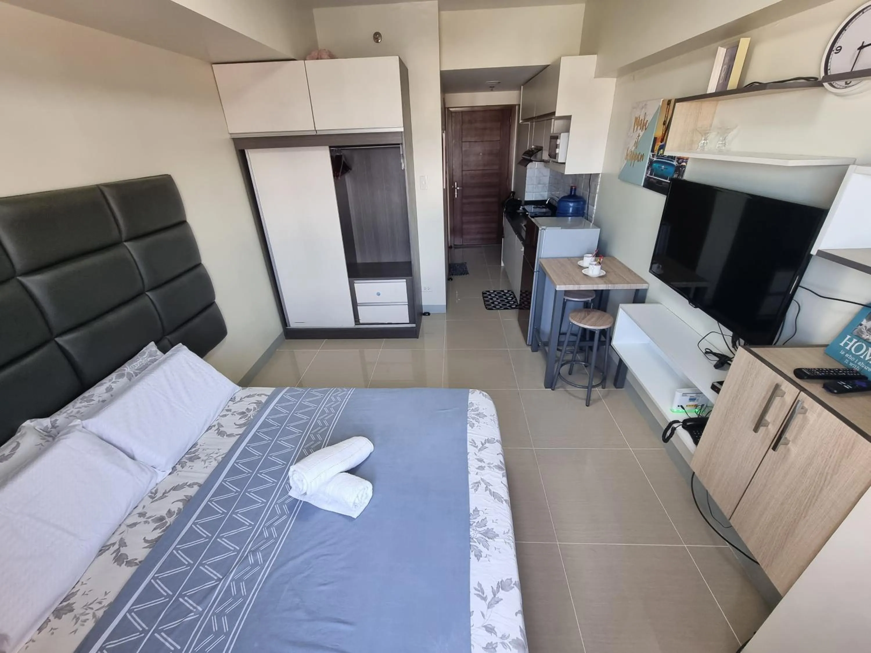 Bed in Studio Condo Unit at Horizons 101