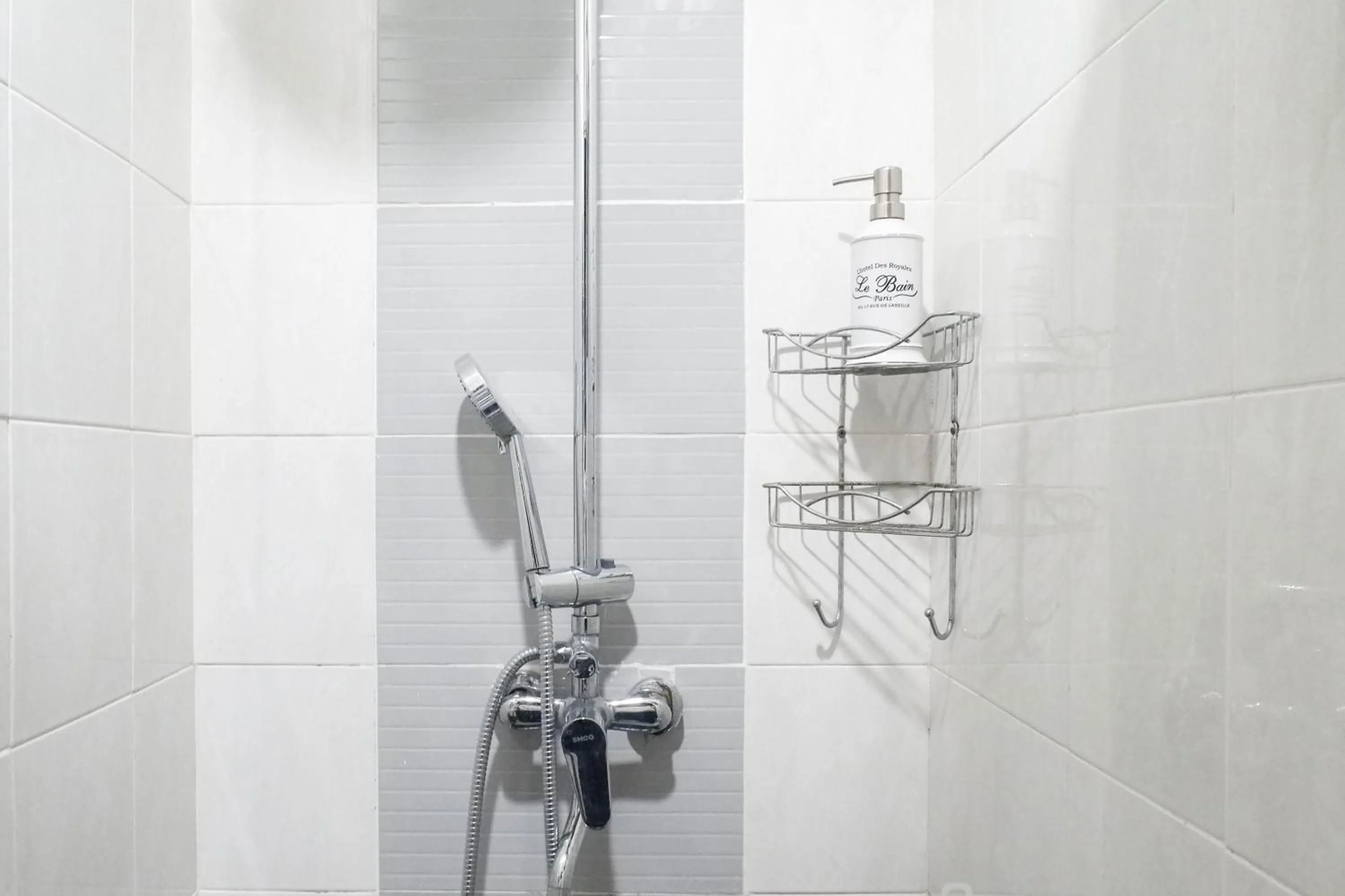 Bathroom in Exquisite 1BR Apartment at Puri Mas By Travelio