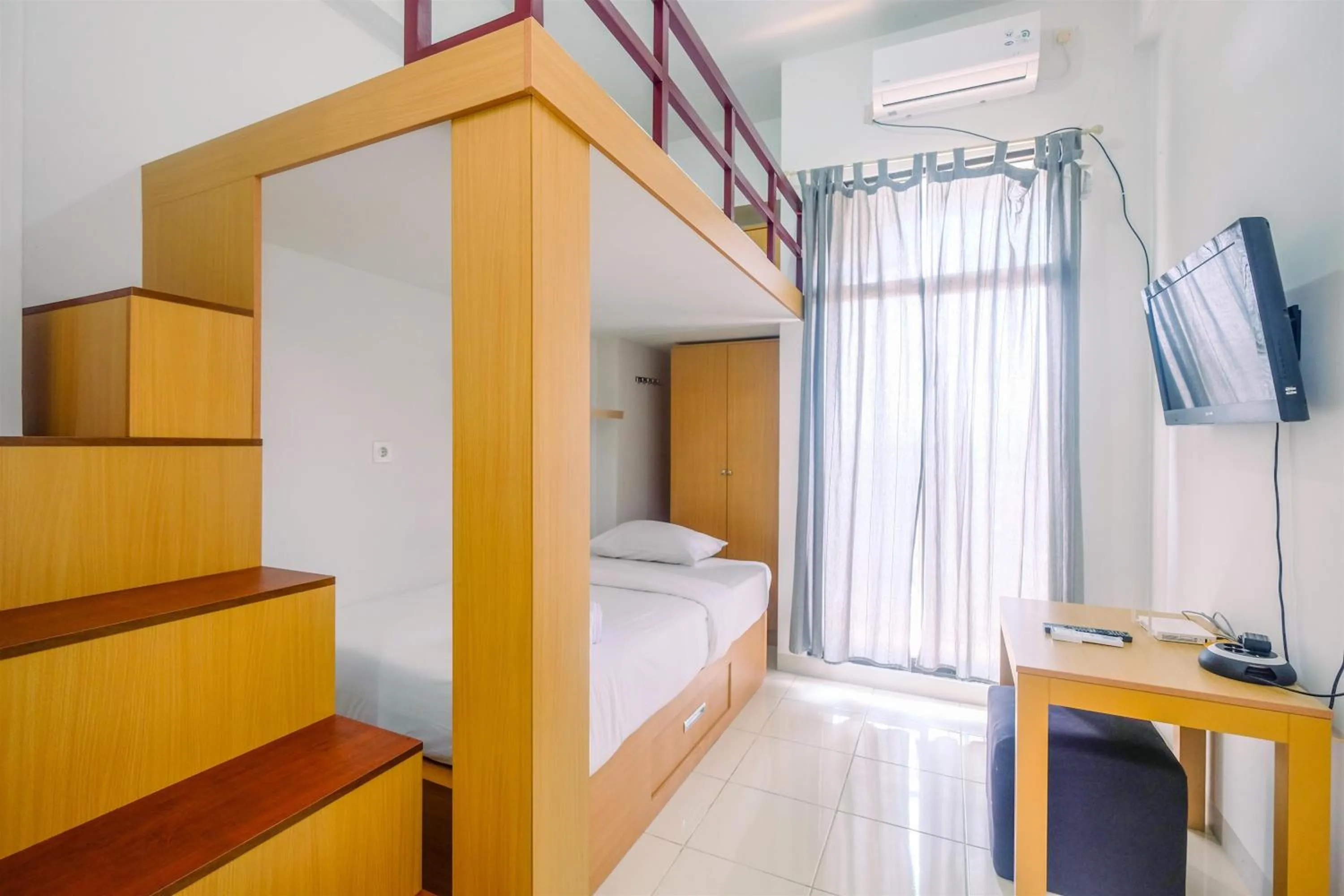 Bedroom, Bed in Great Deal Studio at Dave Apartment near Campus By Travelio