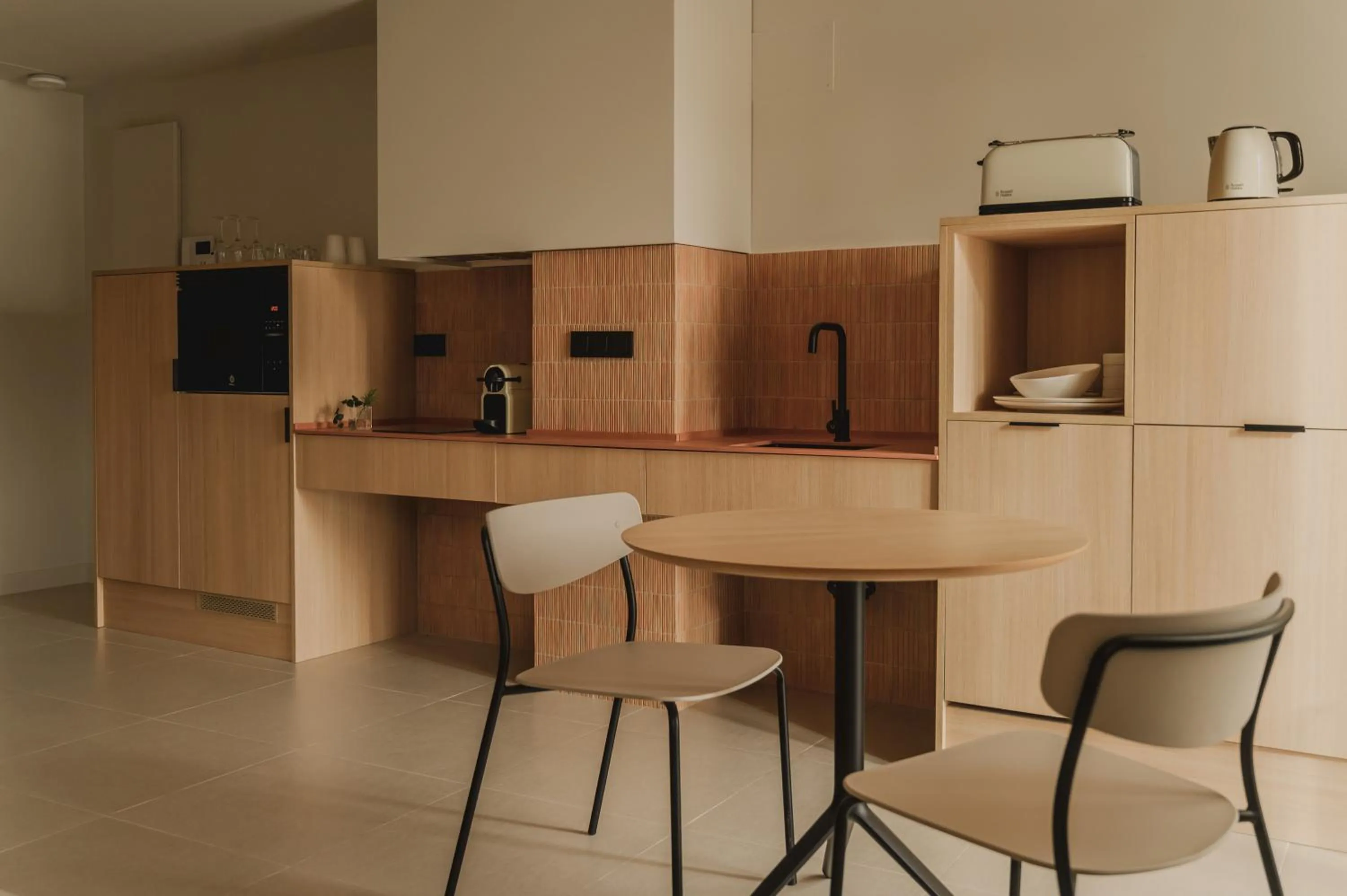Kitchen or kitchenette in Pau Suites