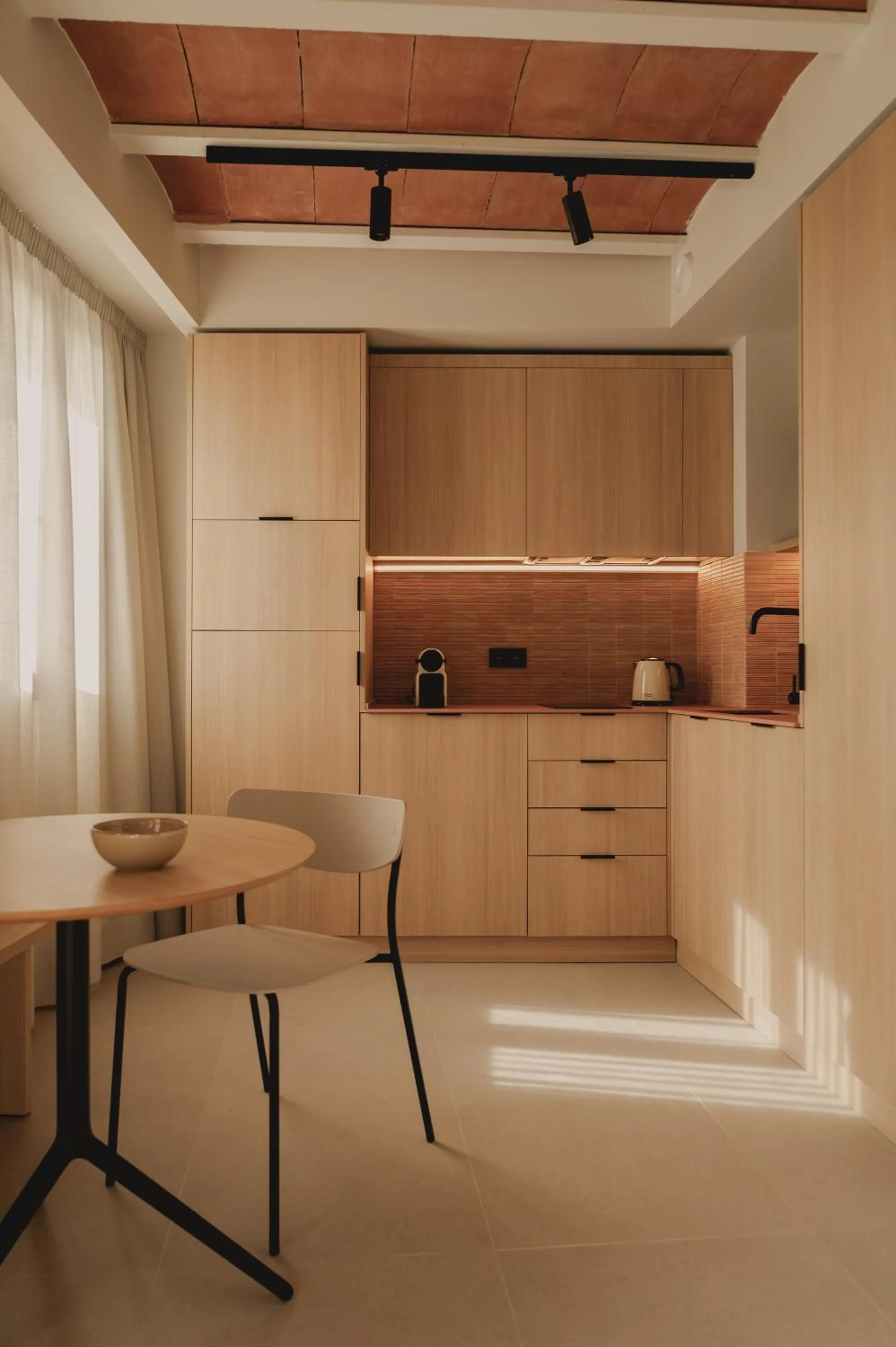 Kitchen or kitchenette in Pau Suites