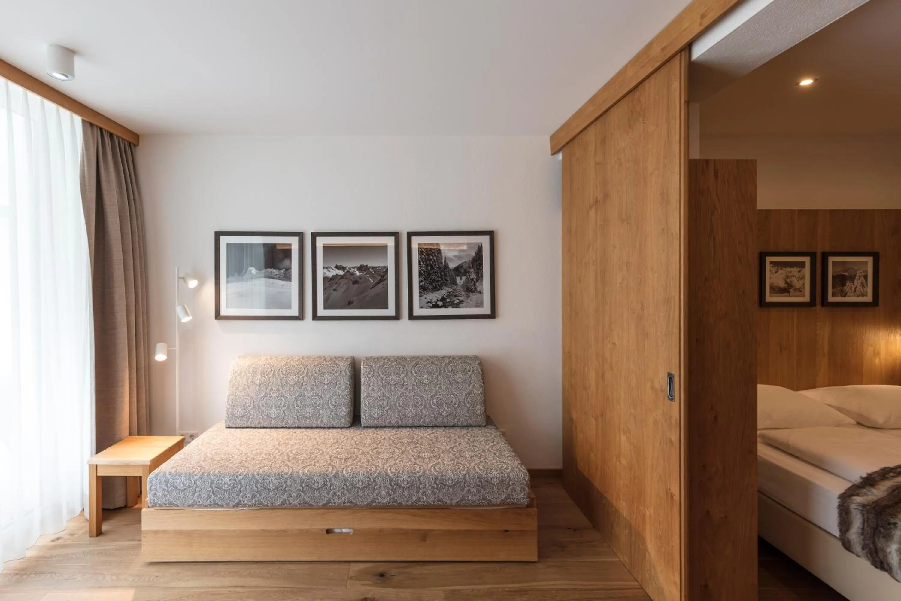 Living room, Bed in ArlBerglife Ferienresort