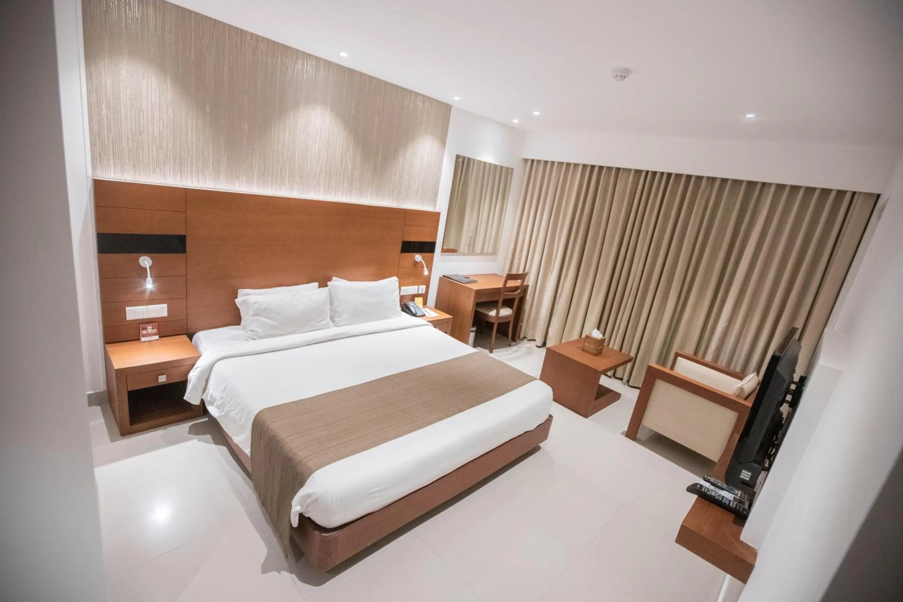 Bed in Hotel Niya Regency