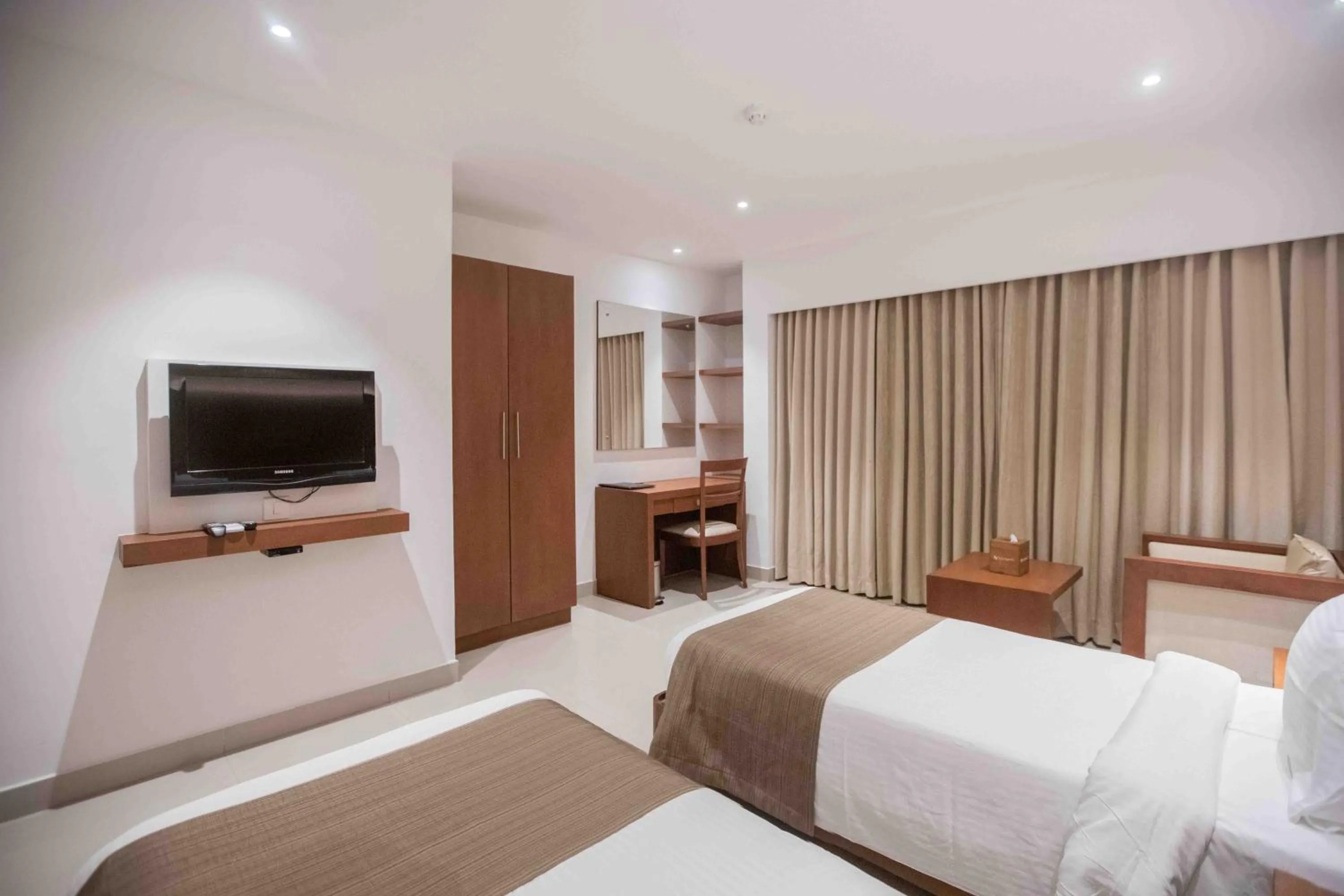 Bed in Hotel Niya Regency