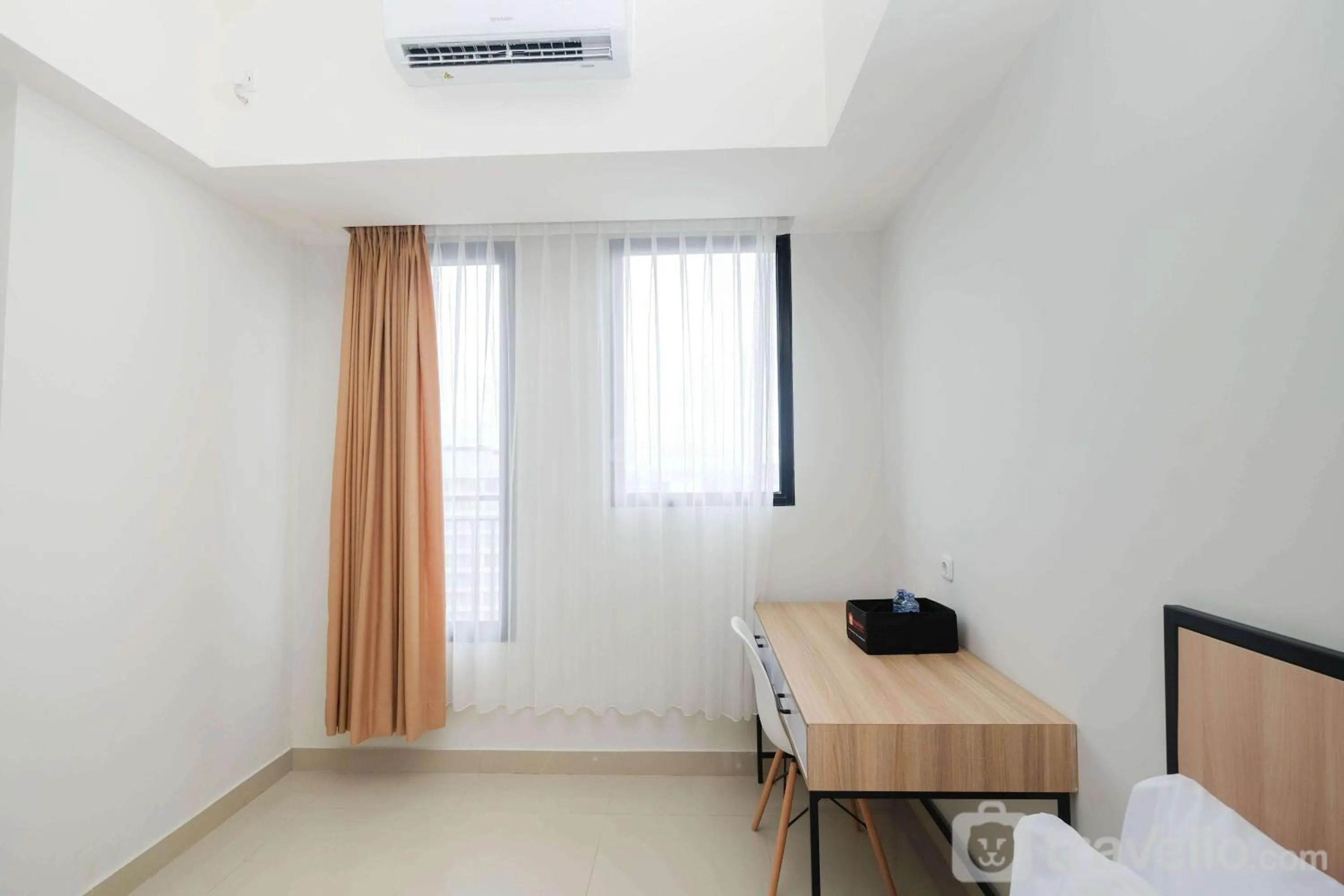 Bed in Pleasurable Studio at Evenciio Apartment near Campus Area By Travelio