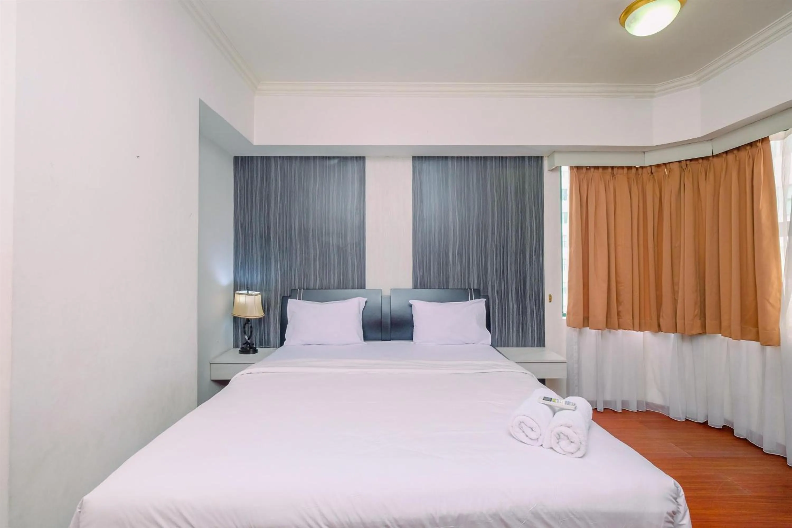 Bed in Comfort 2BR + Extra Room at Sudirman Tower Condominium Apartment By Travelio