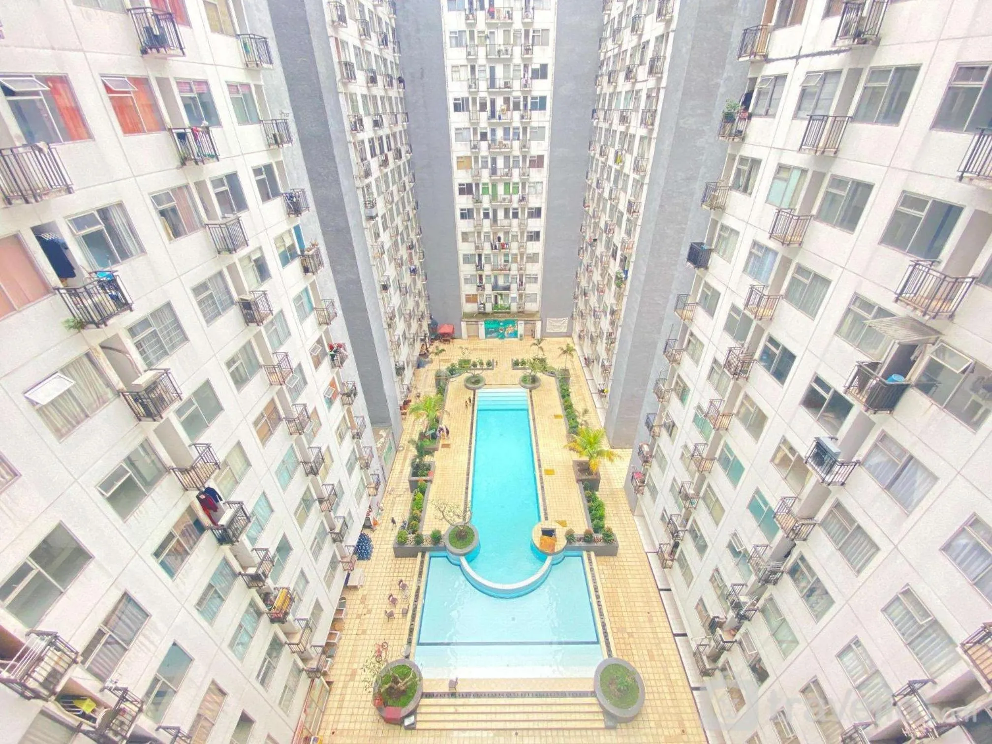 Property building in Cozy Living 2BR Apartment at Jarrdin Cihampelas By Travelio