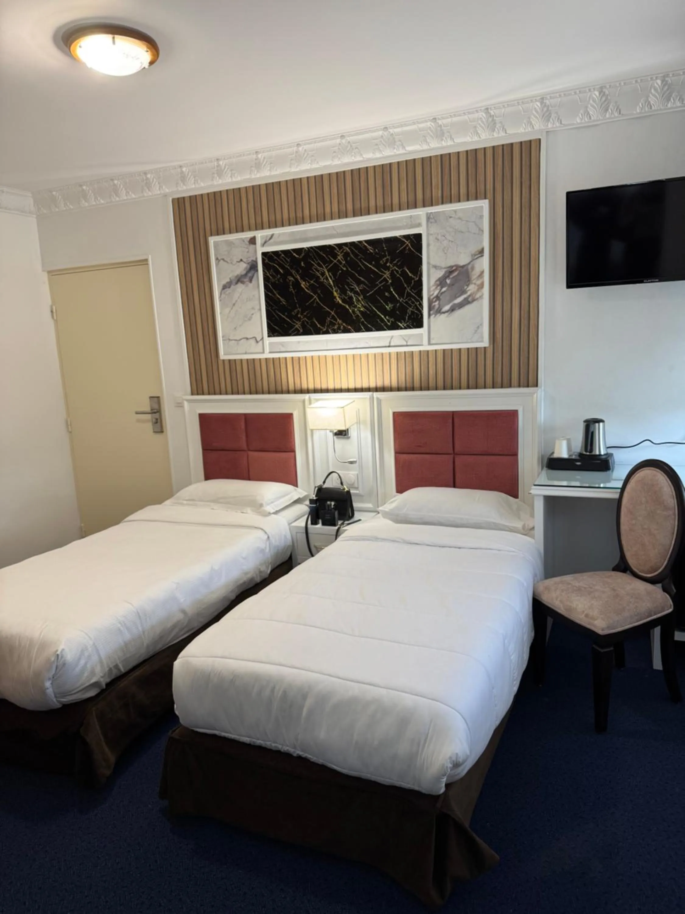 Bed in Hotel Grand Paris