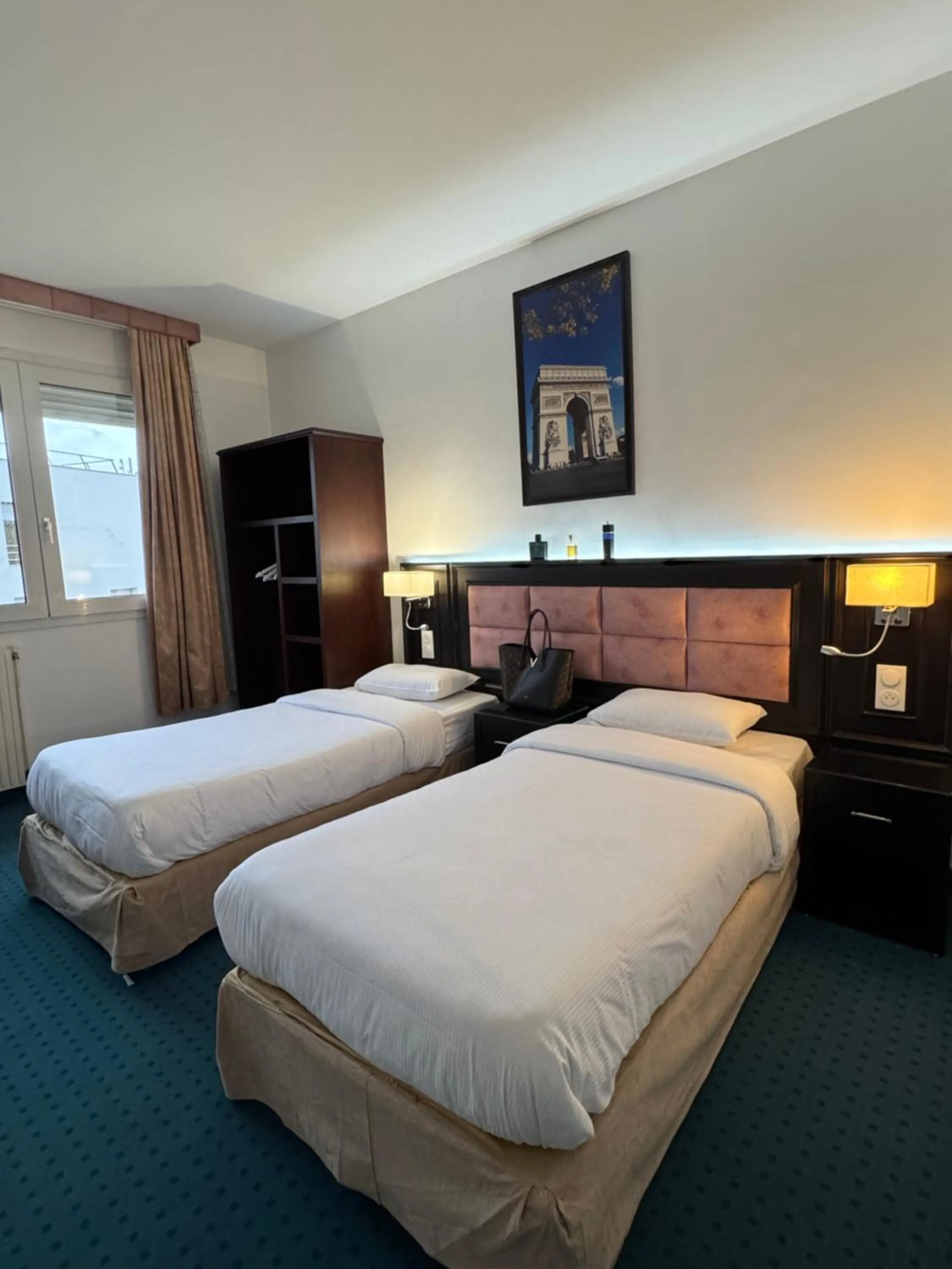 Bed in Hotel Grand Paris