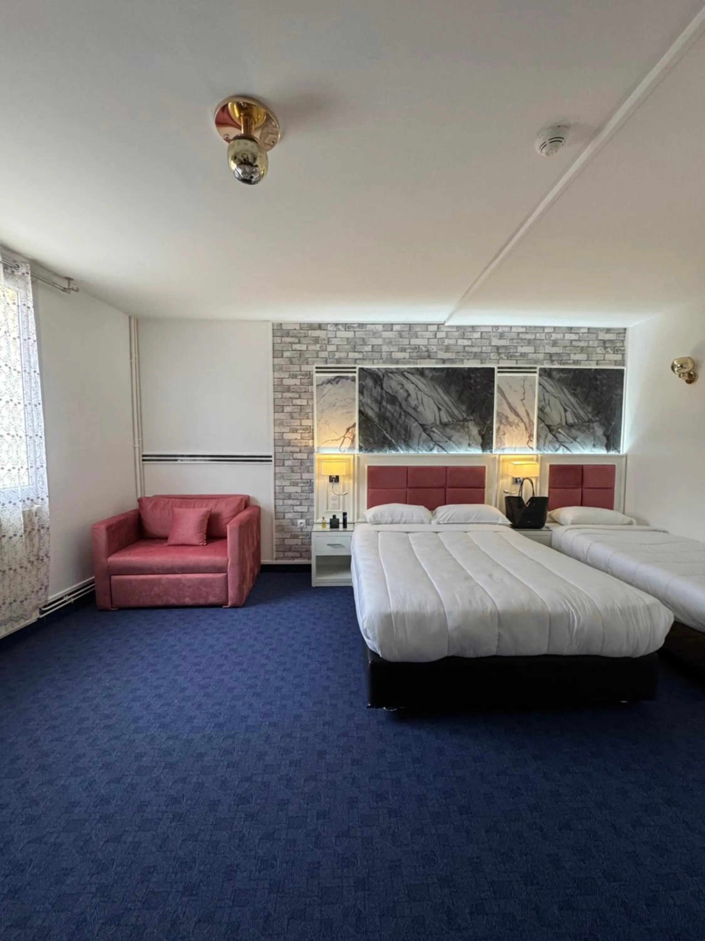 Bed in Hotel Grand Paris