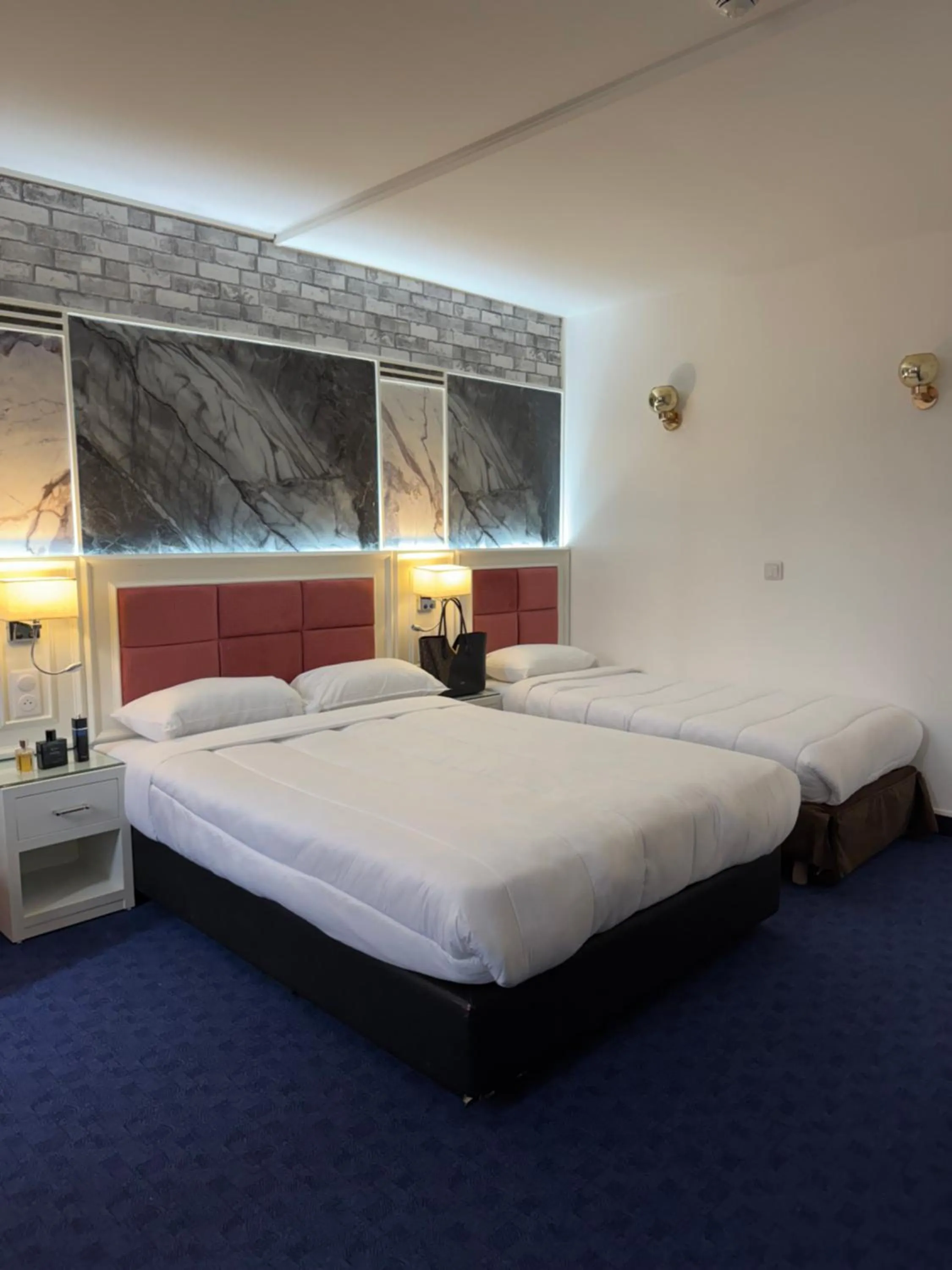 Bed in Hotel Grand Paris