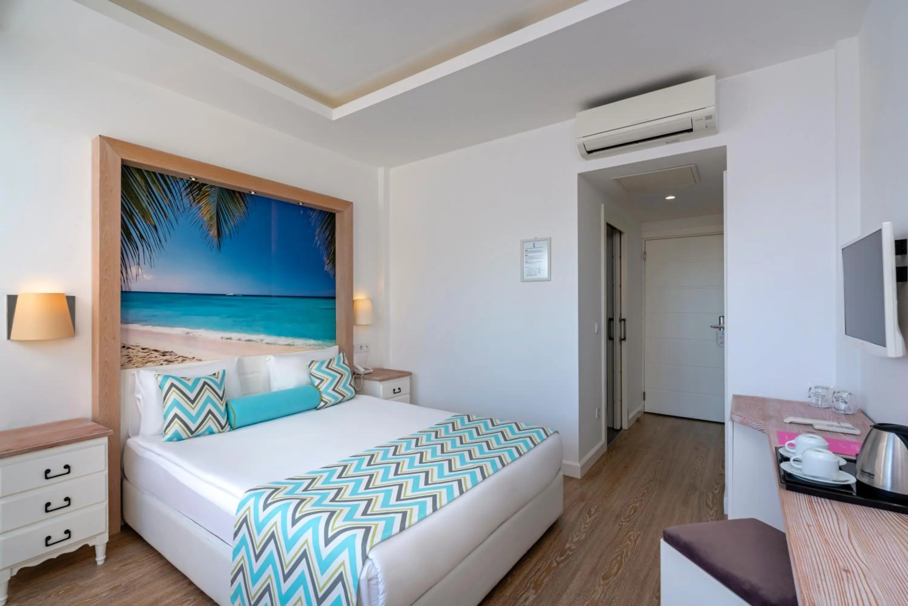 Bed in Iz Flower Side Beach Hotel