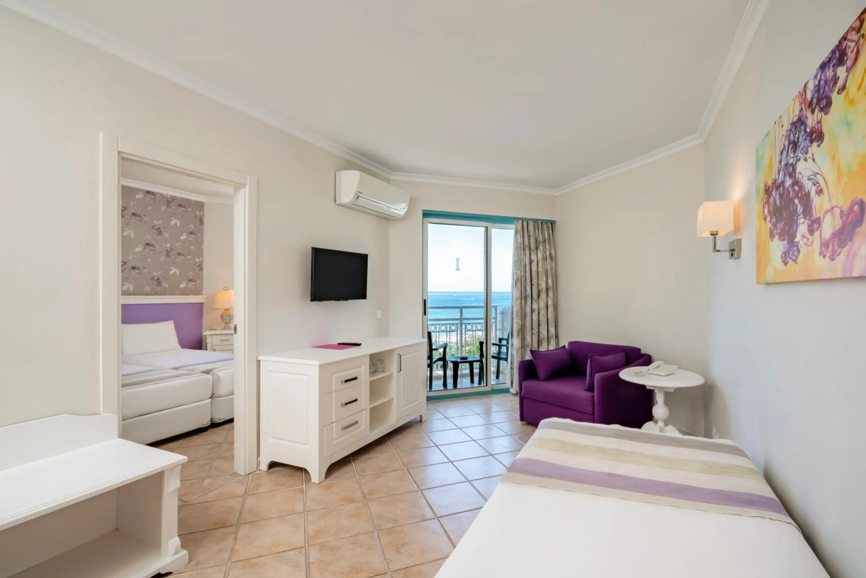 Bed in Iz Flower Side Beach Hotel